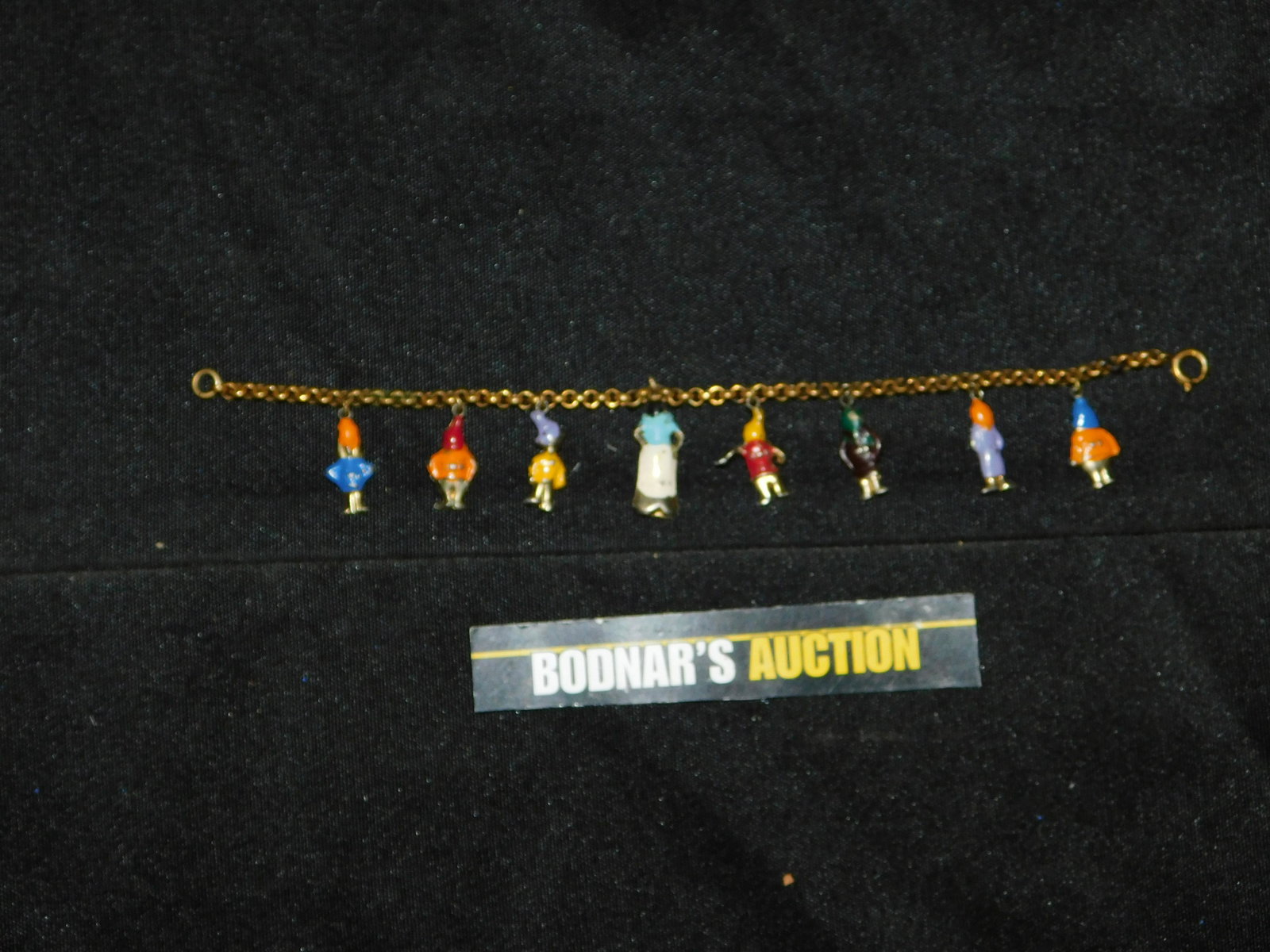 Vintage Snow White and The Seven Dwarfs Charm Bracelet: Vintage Snow White and The Seven Dwarfs Charm Bracelet. Some Paint Loss. This sale is an in-house shipping sale on most items with a $10.00 per lot packing/handling fee. Please read the Complete Terms