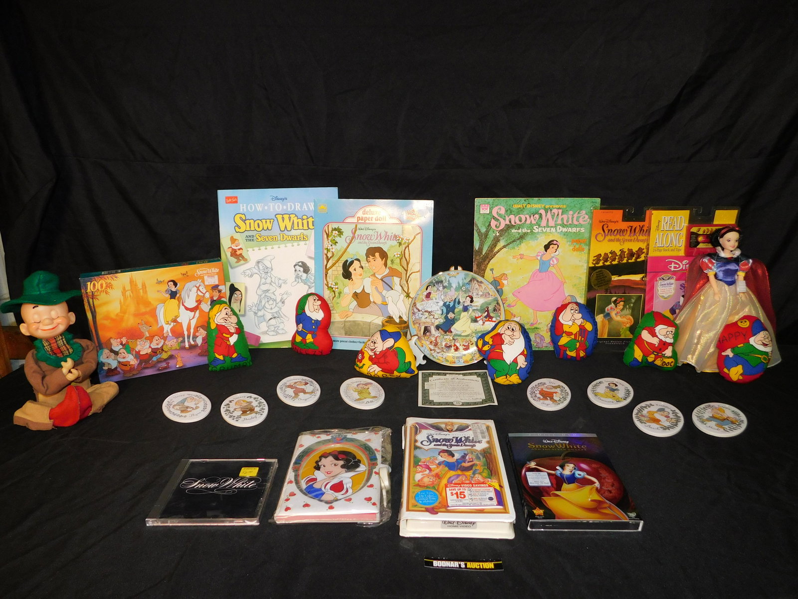 Grouping of Snow White Items including Collector Plate: Grouping of Snow White Items including Collector Plate, Puzzles, Paper Dolls, and More. This sale is an in-house shipping sale on most items with a $10.00 per lot packing/handling fee. Please read the