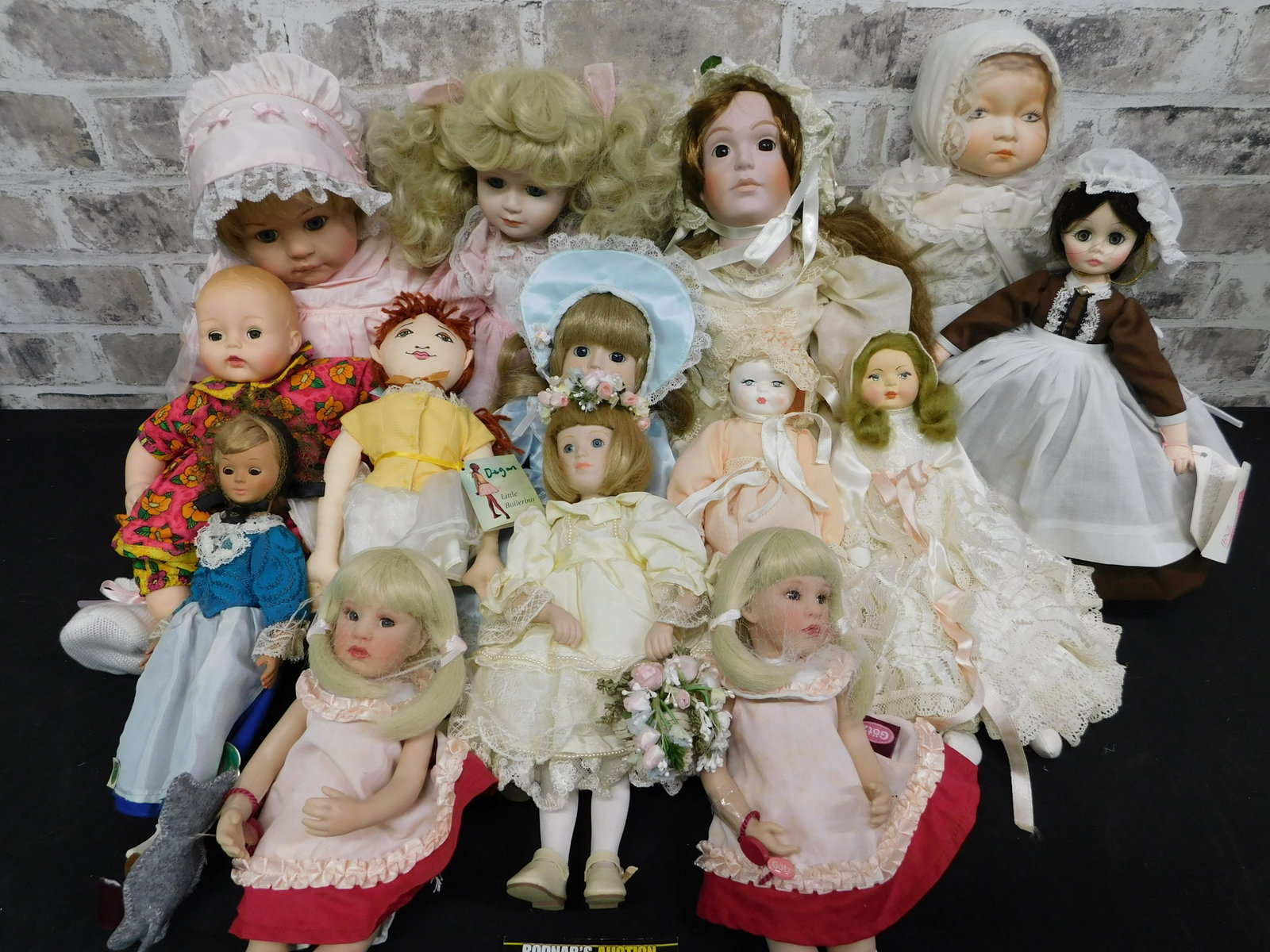 Mix Lot of 14 Porcelain, Vinyl, and Cloth Dolls: Mix Lot of 14 Porcelain, Vinyl, and Cloth Dolls including Madame Alexander, Gorham, Gotz, and More. Girl in White Bonnet needs to be restrung. This sale is an in-house shipping sale on most items with