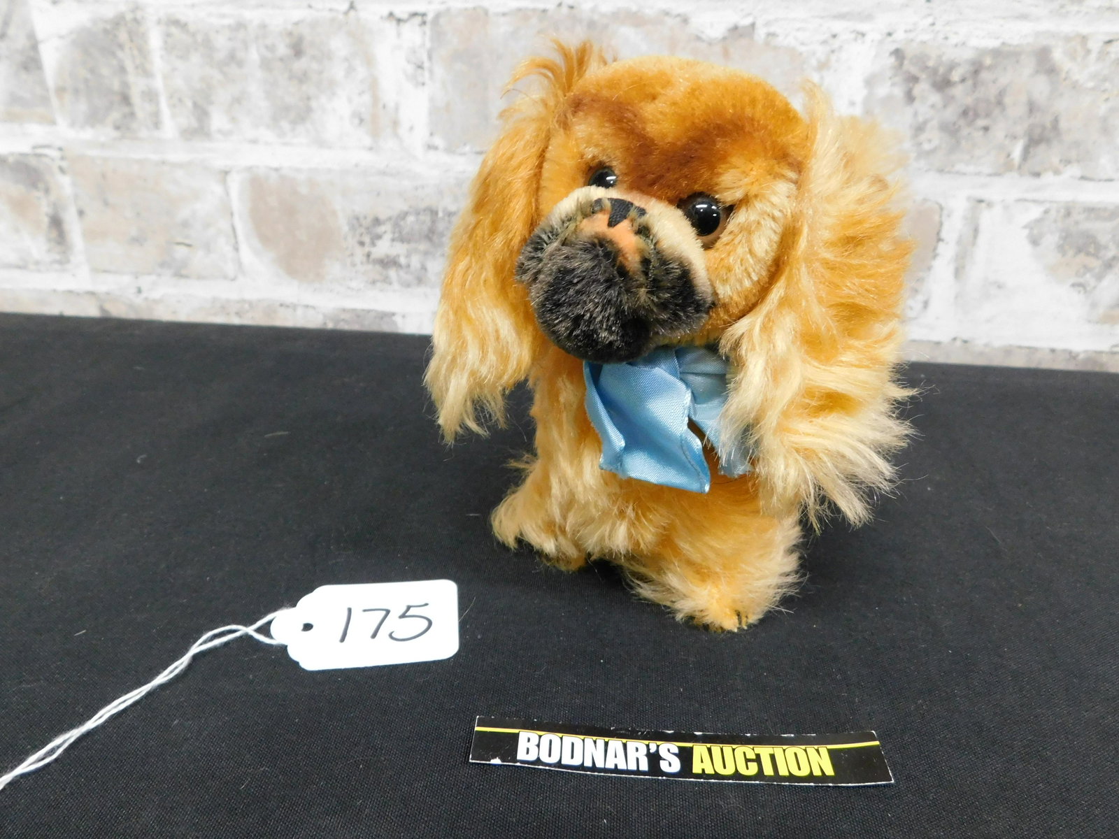 Steiff Pekinese Dog: Steiff Pekinese Dog #4120/14. Tag attached on Ear. This sale is an in-house shipping sale on most items with a $10.00 per lot packing/handling fee. Please read the Complete Terms & Conditions for Loca