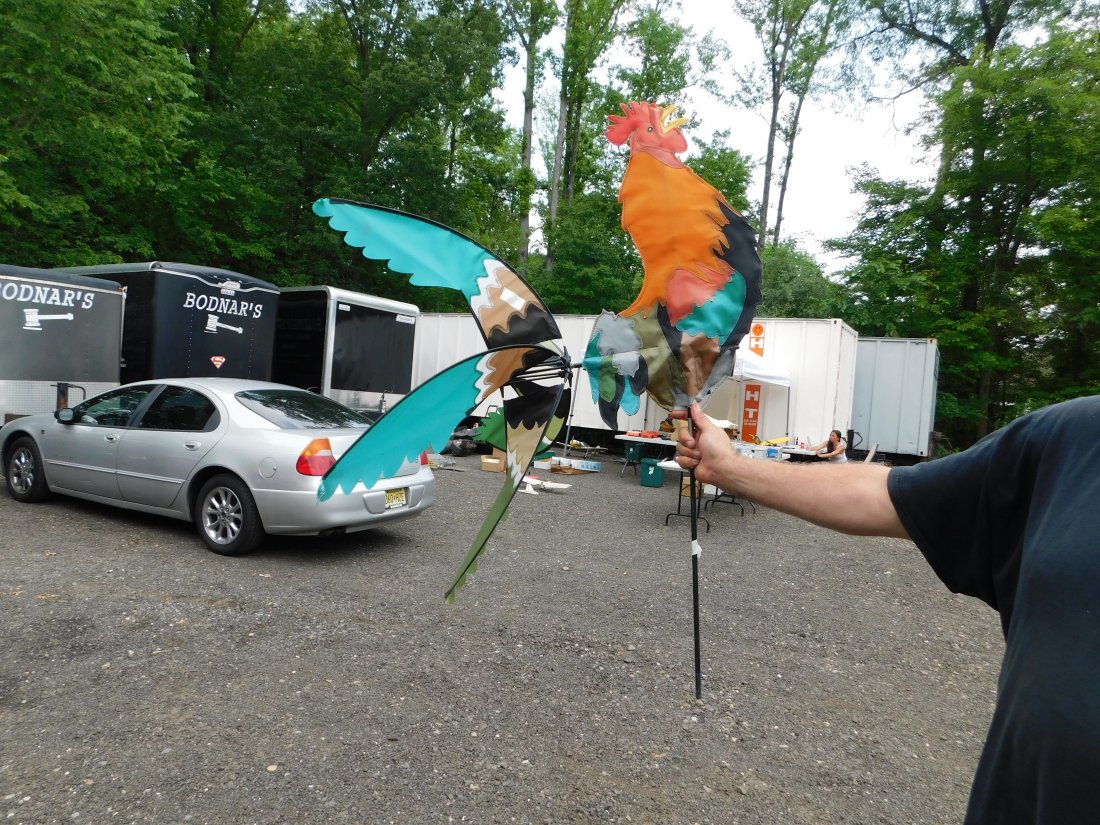Rooster Whirligig: Rooster Whirligig. Measures 53" tall x 30" long. You are bidding at a live sale. Please read the terms and conditions. This sale will be broadcast live on sale day with full descriptions of each lot b
