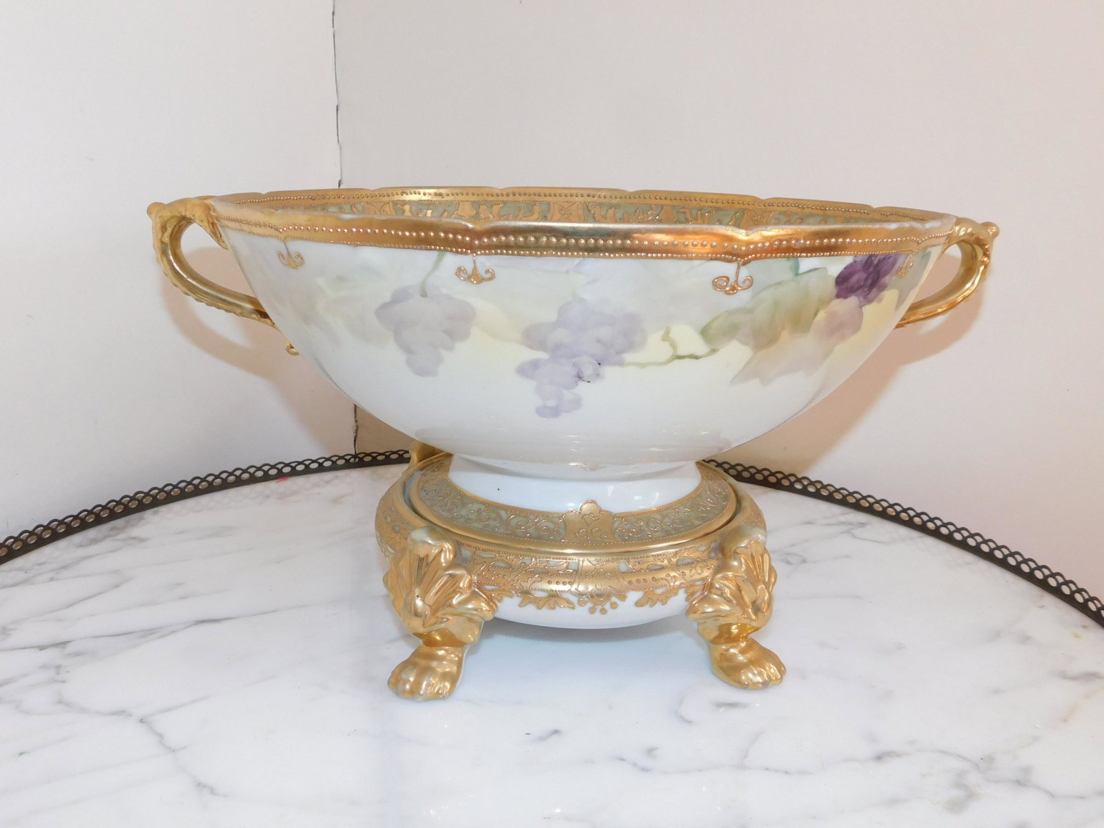 Nippon Center Bowl with Stand: Hand Painted Nippon Center Bowl with Center Stand. The Stand has a few chips on interior rim. Measures 8.25" tall x 16" wide. This sale is an in-house shipping sale on most items with a $10.00 per lot