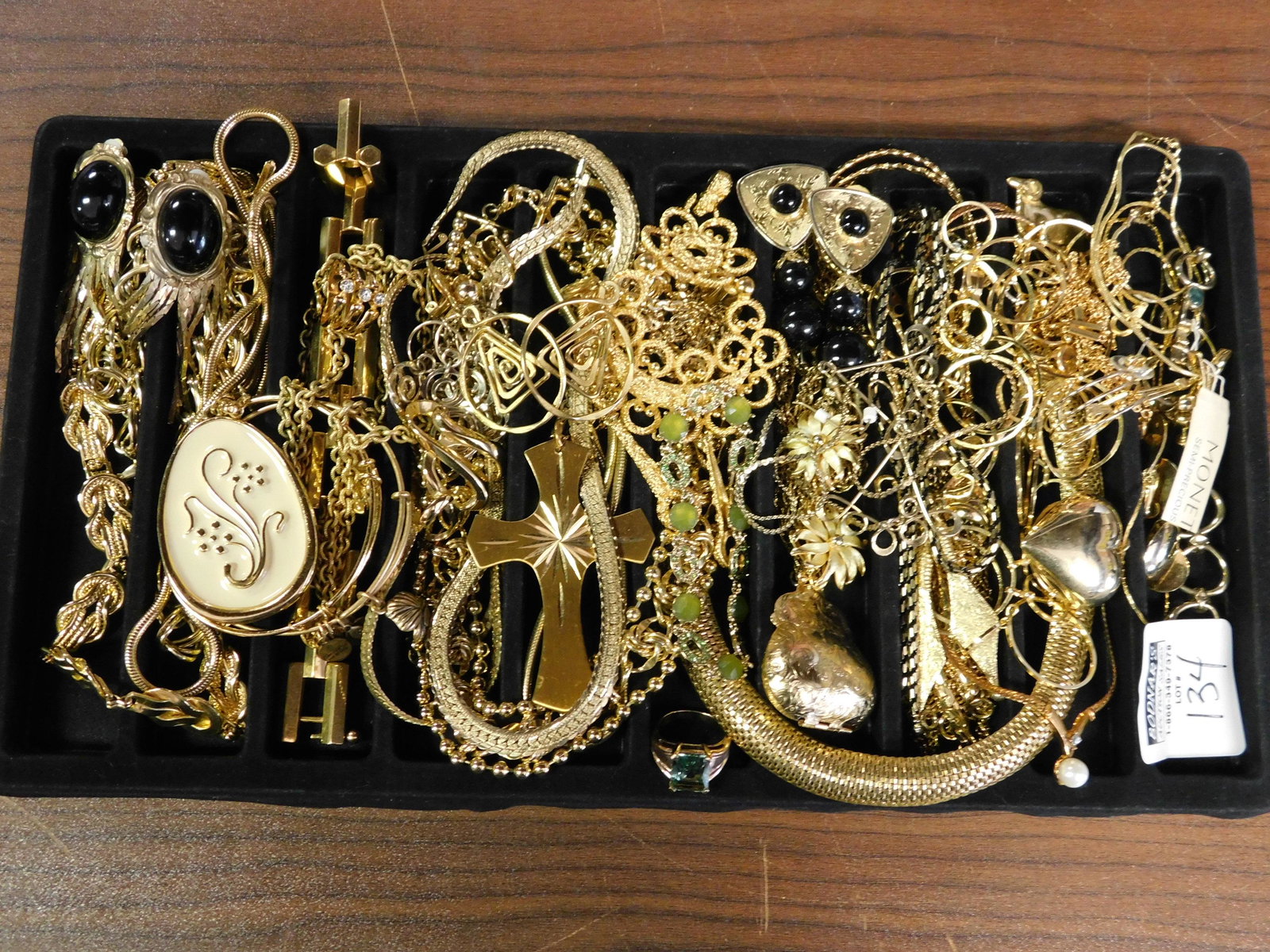 Lot of Gold Tone Jewelry: Lot of gold tone jewelry. Necklaces, earrings, bracelet and a ring. All items must be paid for within 24 hours of the sale. Local pickups are in our South Brunswick location on Thursday, Friday, Satur