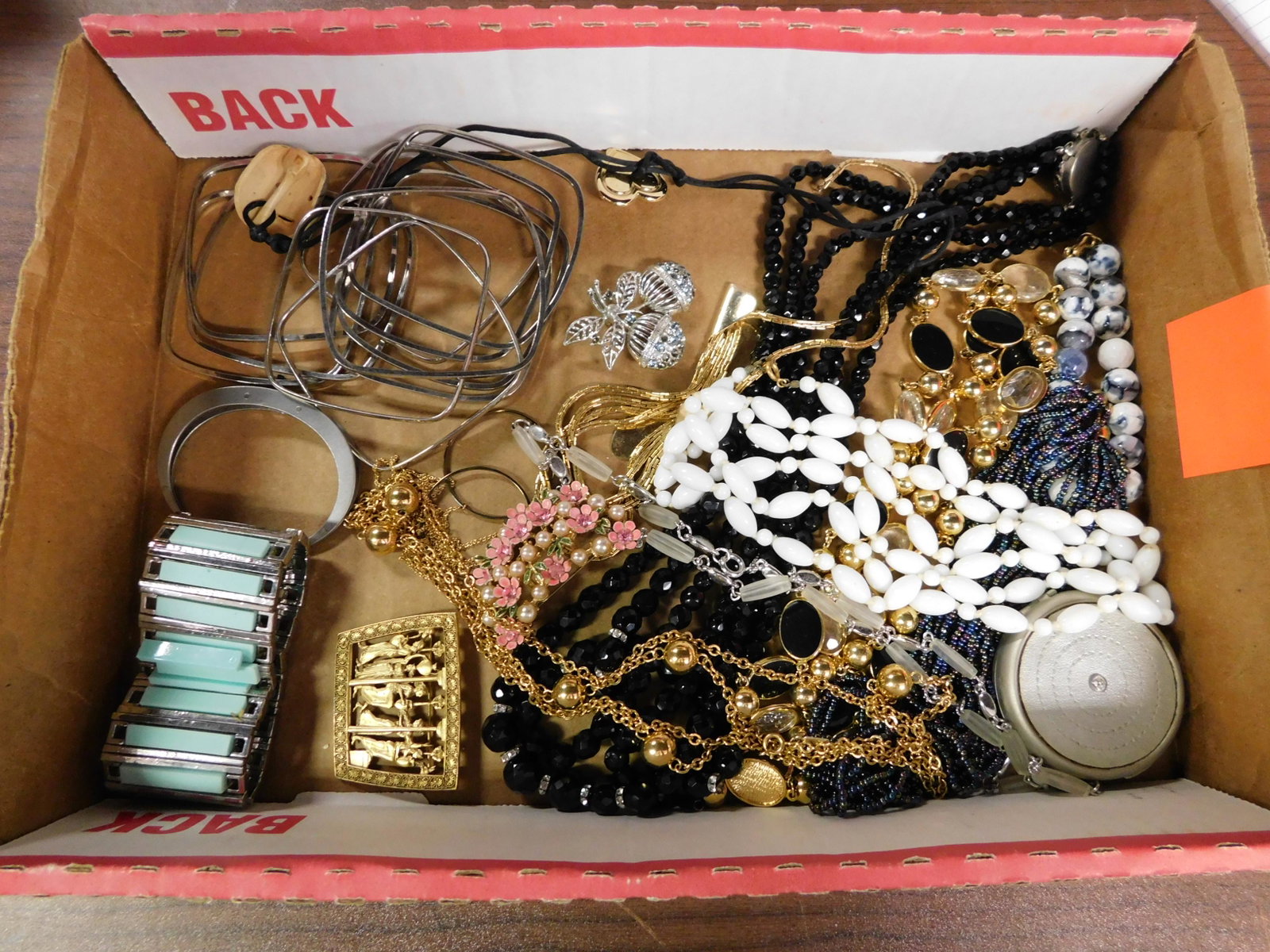 Lot of Costume Jewelry: Lot of costume jewelry. Some missing stones, some damaged pieces. Some signed MFA, Monet. All items must be paid for within 24 hours of the sale. Local pickups are in our South Brunswick location on T
