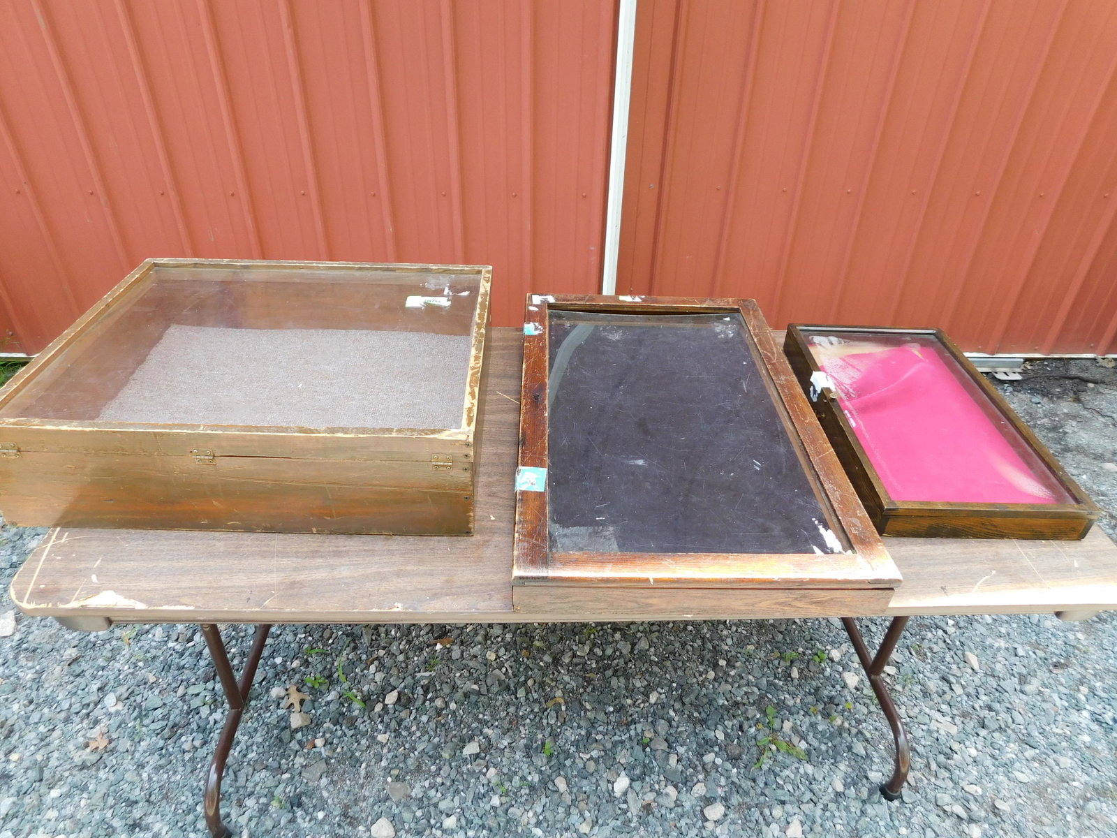 Lot of 3 Wooden Table Top Showcases: Lot of 3 Wooden Homemade Table Top Showcases. 2 have plexiglass and one has glass. Heavily Used Condition. The plexi on one showcase is starting to warp in. They measure 21.5" x 25.5" x 7", 31" x 19"