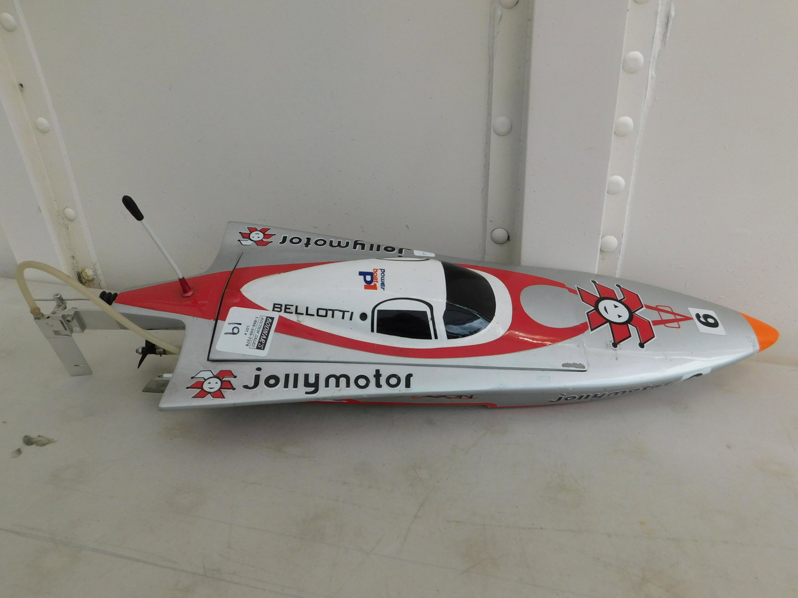 RC Jolly Motor Speedboat: RC Jolly Motor Speedboat with wooden body and brushless electric motor. Measures 25" long x 8" wide. All RC items in this sale from a local estate and have not been checked to see if they are running 