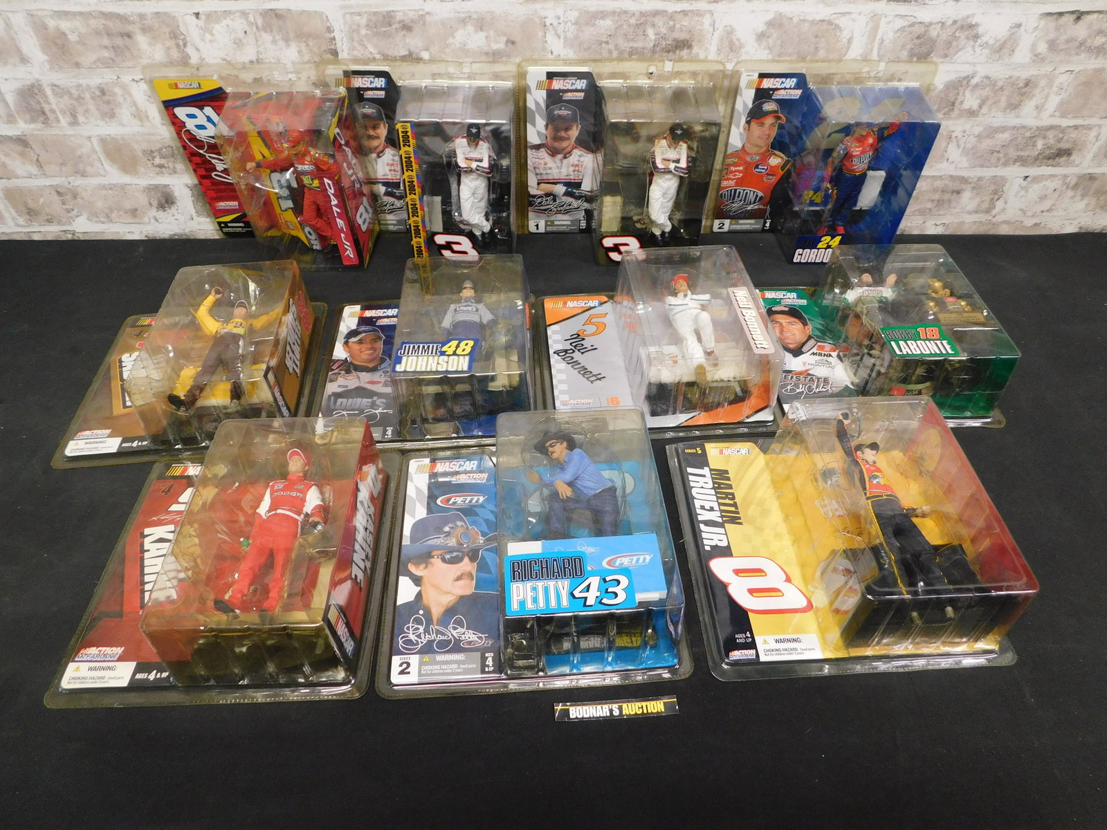 Lot of 11 McFarlane NASCAR Drivers: Lot of 11 McFarlane NASCAR Drivers. Some drivers included in this lot are Dale Jr, Richard Petty, Dale Sr., Jeff Gordon and More. This sale is an in-house shipping sale on most items with a $10.00 per