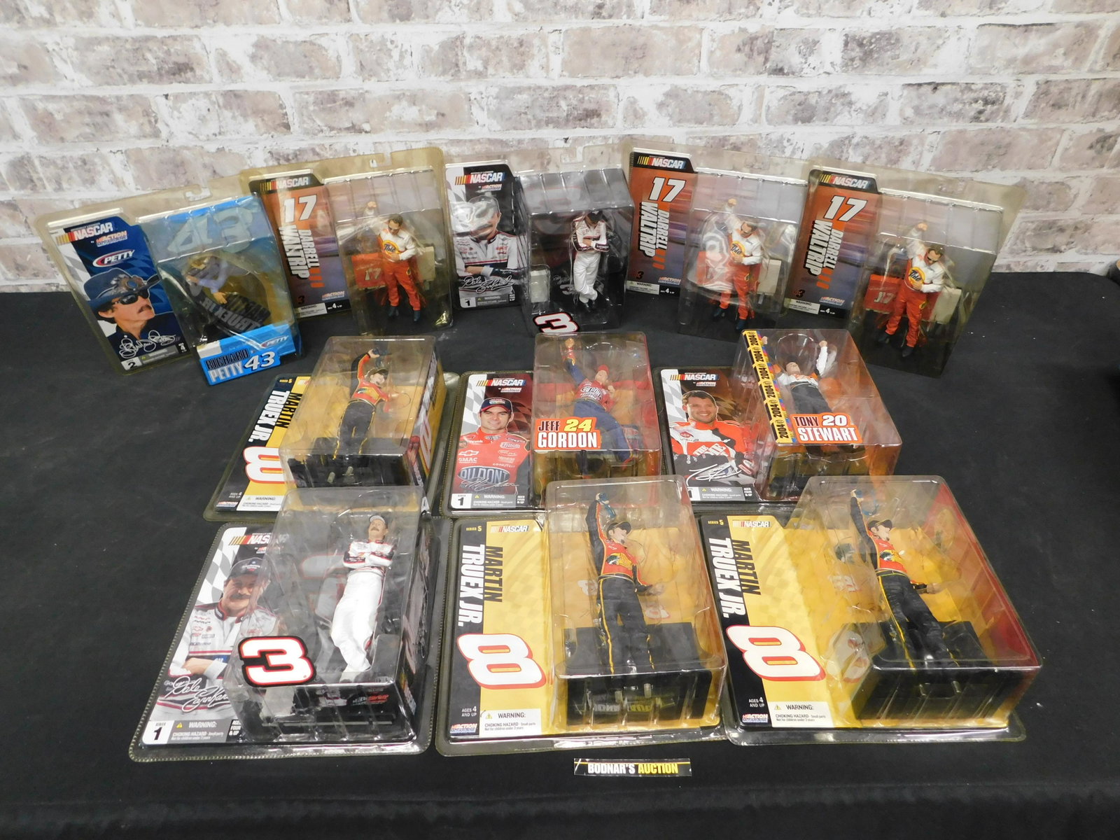 Lot of 11 McFarlane NASCAR Drivers: Lot of 11 McFarlane NASCAR Drivers. Some drivers included in this lot are Dale Earnhardt Sr., Darrell Waltrip, Martin Truex Jr. and More. This sale is an in-house shipping sale on most items with a $1