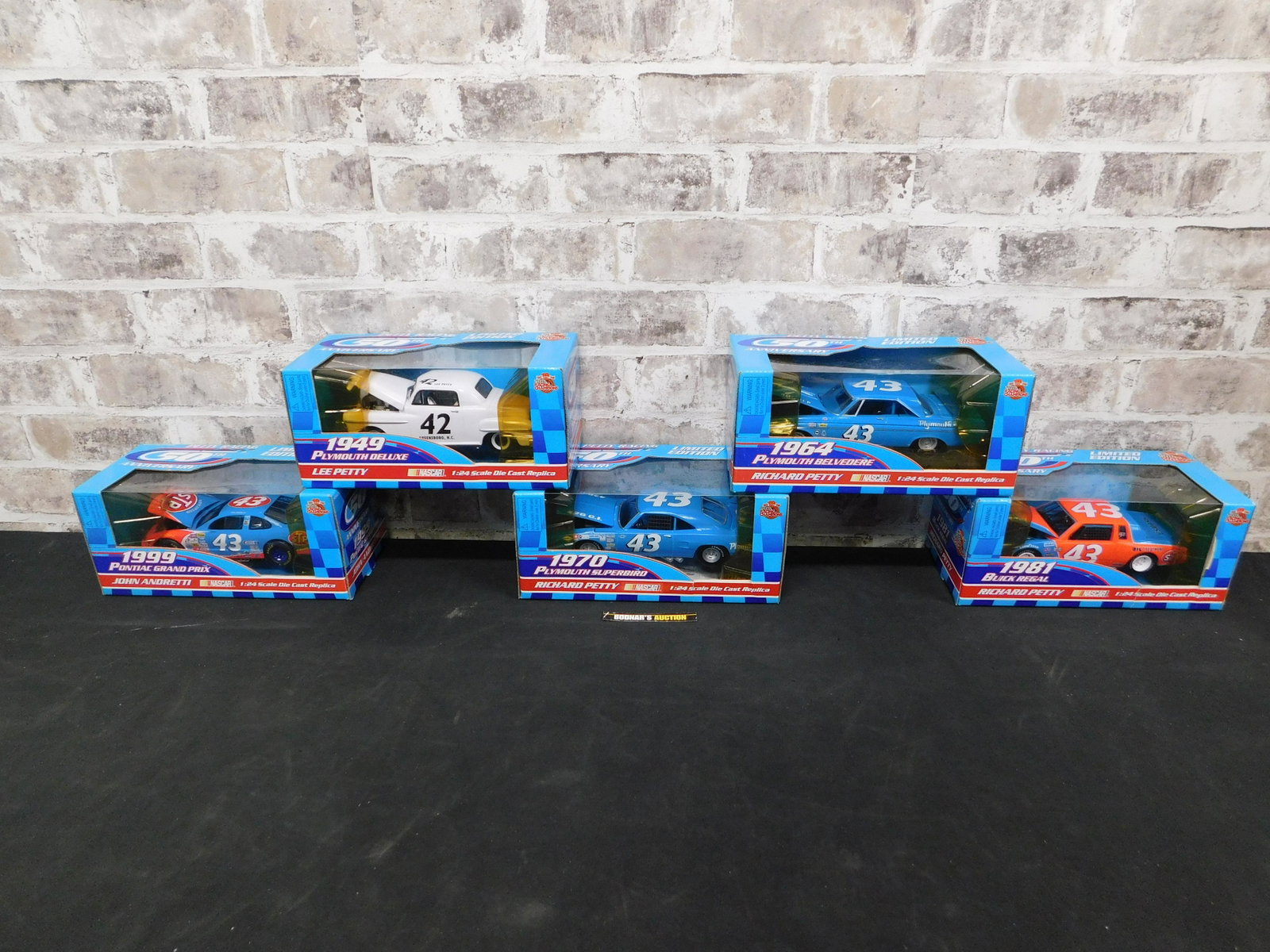 Lot of 5 Petty Racing 50th Anniversary 1:24 Scale: Lot of 5 Petty Racing 50th Anniversary 1:24 Scale Diecast Cars. Included is a Lee Petty 1949 Plymouth Deluxe, Richard Petty 1964 Plymouth Belvedere, Richard Petty 1970 Plymouth Superbird, Richard Pett