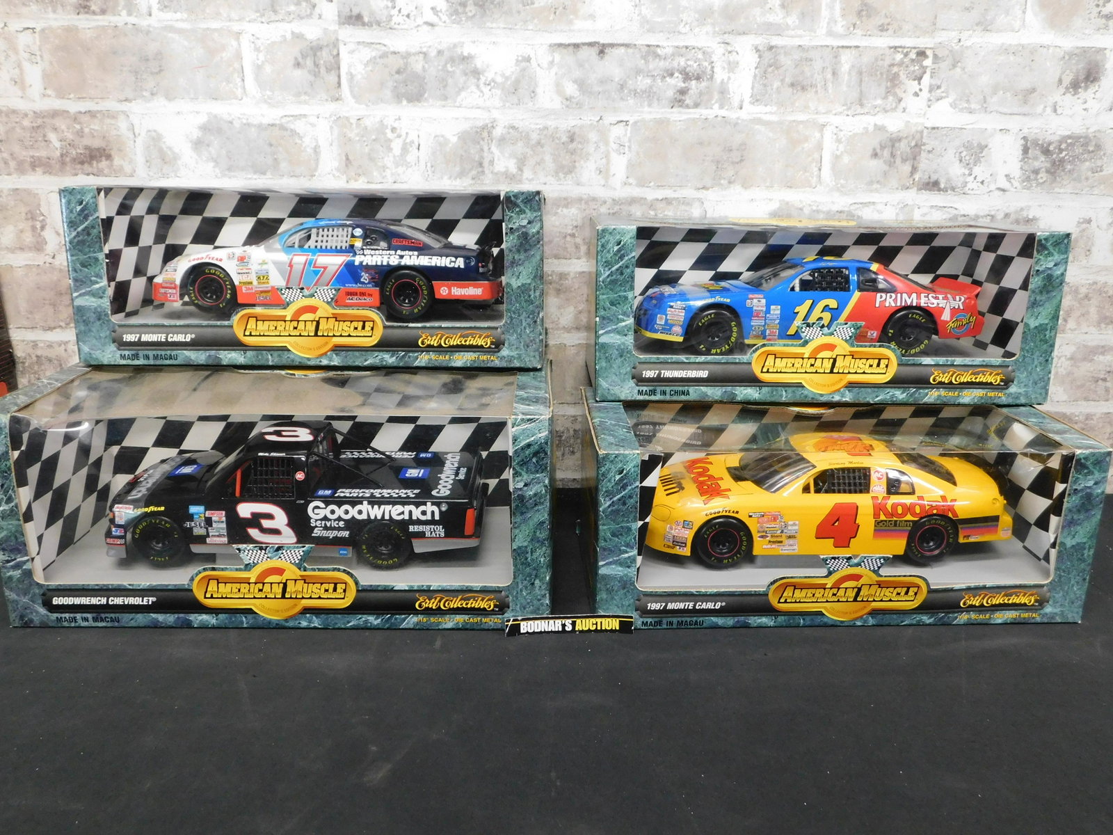 Lot of 4 American Muscle NASCAR Die-Cast: Lot of 4 American Muscle NASCAR 1:18 Scale Die-Cast Cars. Included in this lot is Goodwrench Chevrolet - Mike Skinner, 1997 Monte Carlo - Sterling Marlin, 1997 Thunderbird - Ted Musgrave, and 1997 Mon