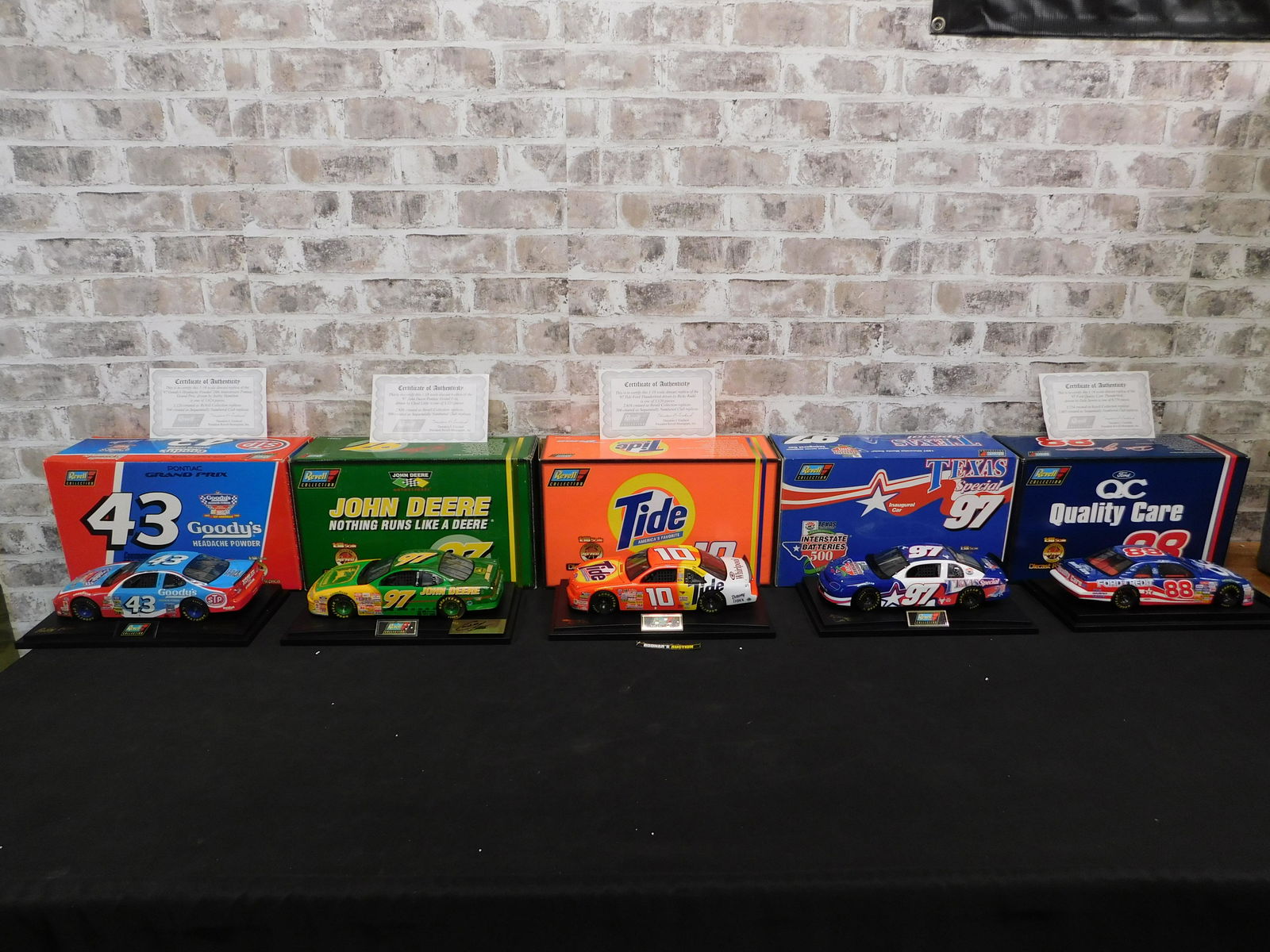 Lot of 5 Revell NASCAR 1:18 Scale Diecast Cars: Lot of 5 Revell NASCAR 1:18 Scale Diecast Cars. Included is a Dale Jarrett #88 Quality Care, Goody's Commemorative Car #43, John Deere #97, Ricky Rudd #10 Tide, and Interstate Batteries Texas Special