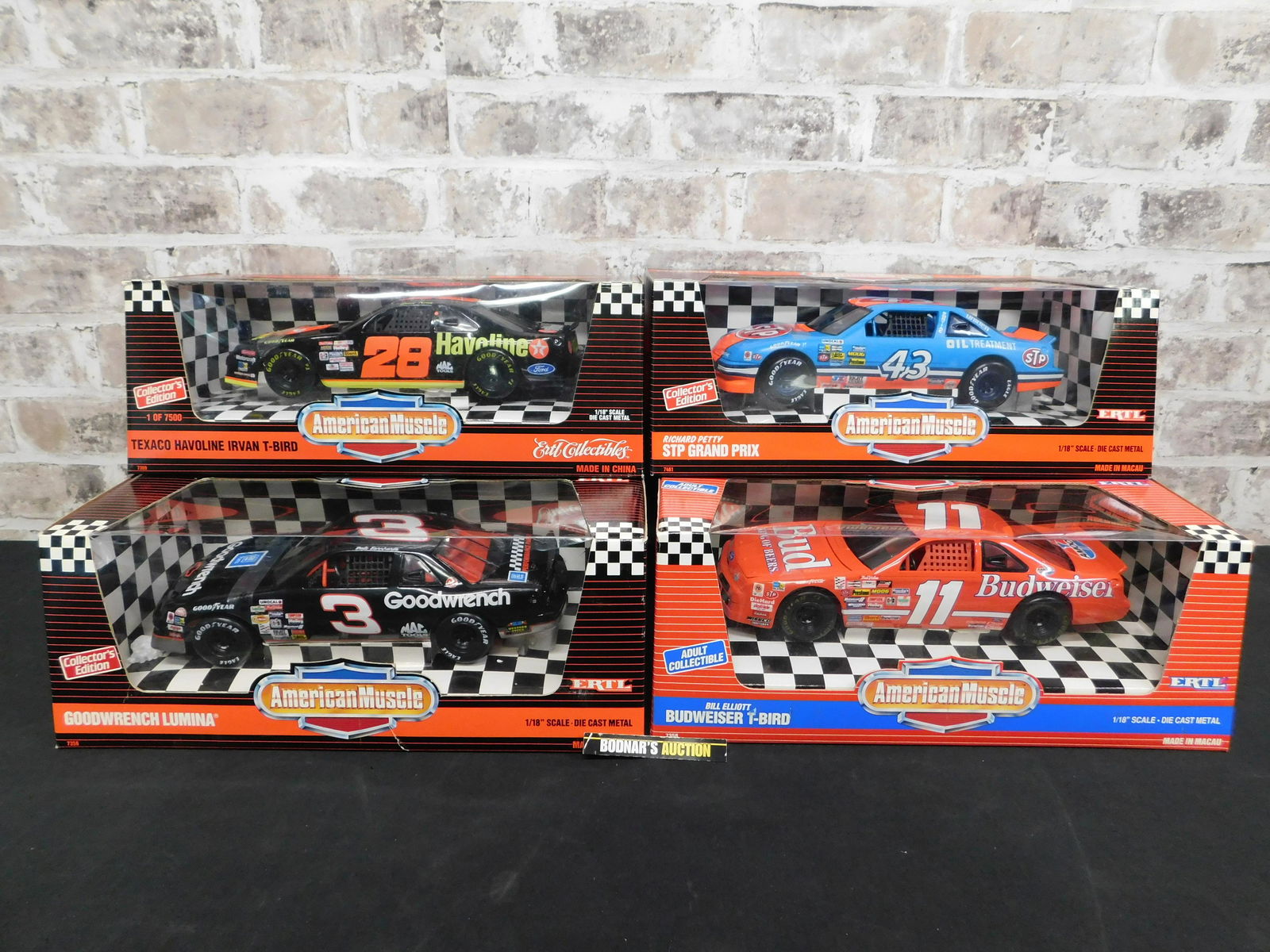 Lot of 4 American Muscle NASCAR Die-Cast: Lot of 4 American Muscle NASCAR 1:18 Scale Die-Cast Cars. Included in this lot is a Goodwrench Lumina - Dale Earnhardt, Bill Elliott Budweiser T-Bird, Richard Petty STP Grand Prix, and Texaco Havoline
