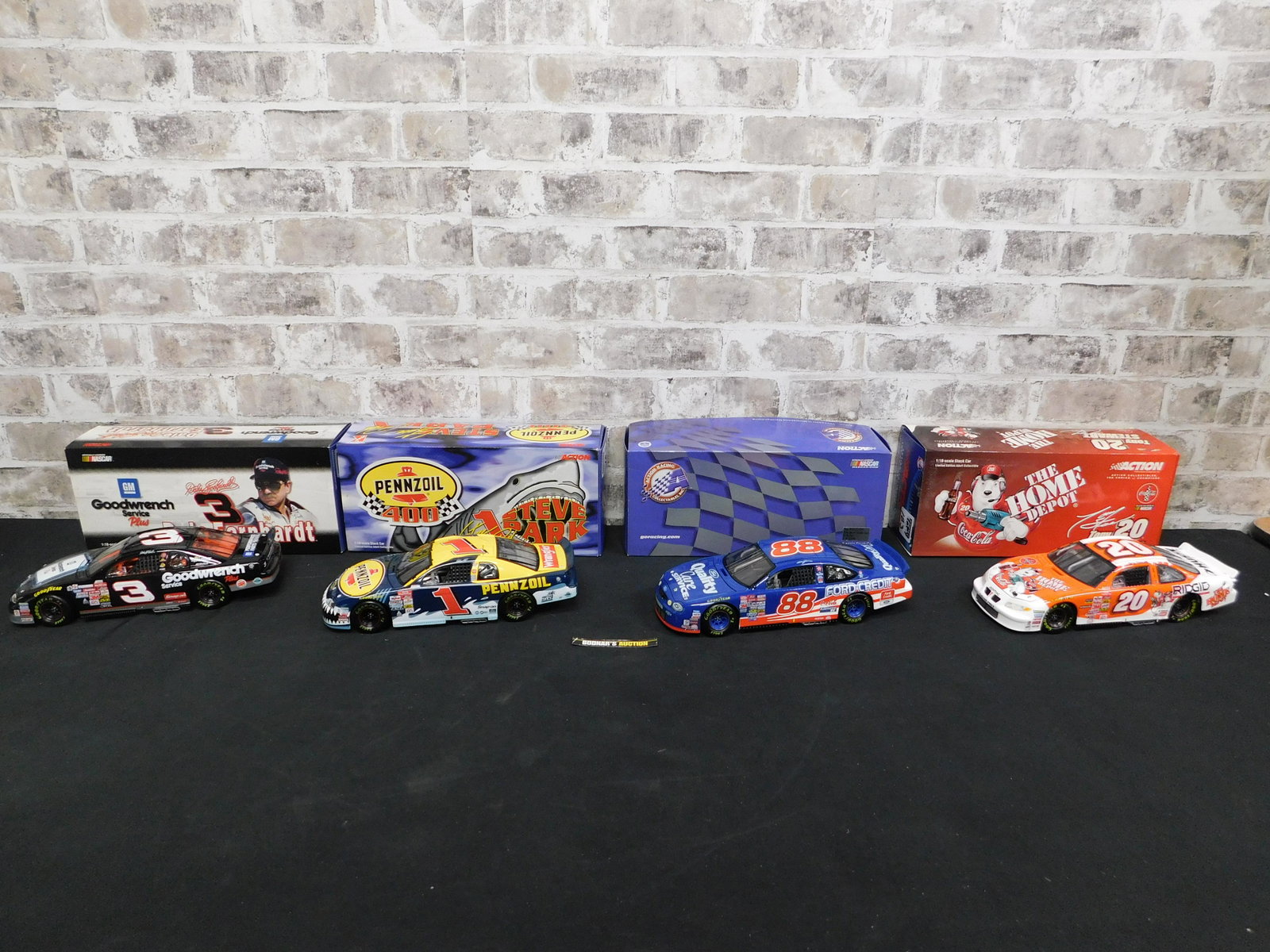 Lot of 4 Action Racing NASCAR 1:18 Scale Die-Cast Cars: Lot of 4 Action Racing NASCAR 1:18 Scale Die-Cast Cars. Included in this lot is a Steve Park #1 Pennzoil, Dale Jarrett Quality Care - Missing Outer Sleeve, Dale Earnhardt #3 GM Goodwrench Service Plus