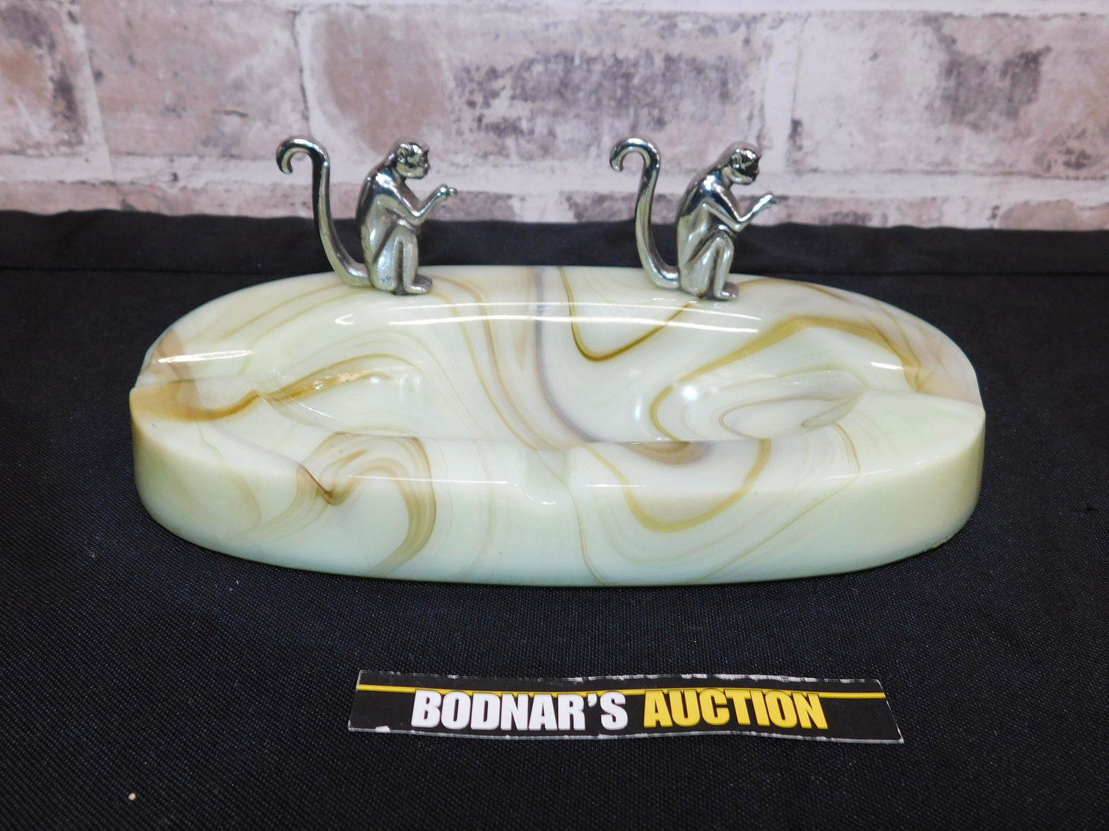 Art Deco Ashtray - Agate with Monkey Design: Art Deco Agate with Silverplate Monkey Design Ashtray. Measures approx. 7.5" x 4.5". All invoices must be paid within 24 hours of the sale. All items are shipped USPS and will be billed separately. A