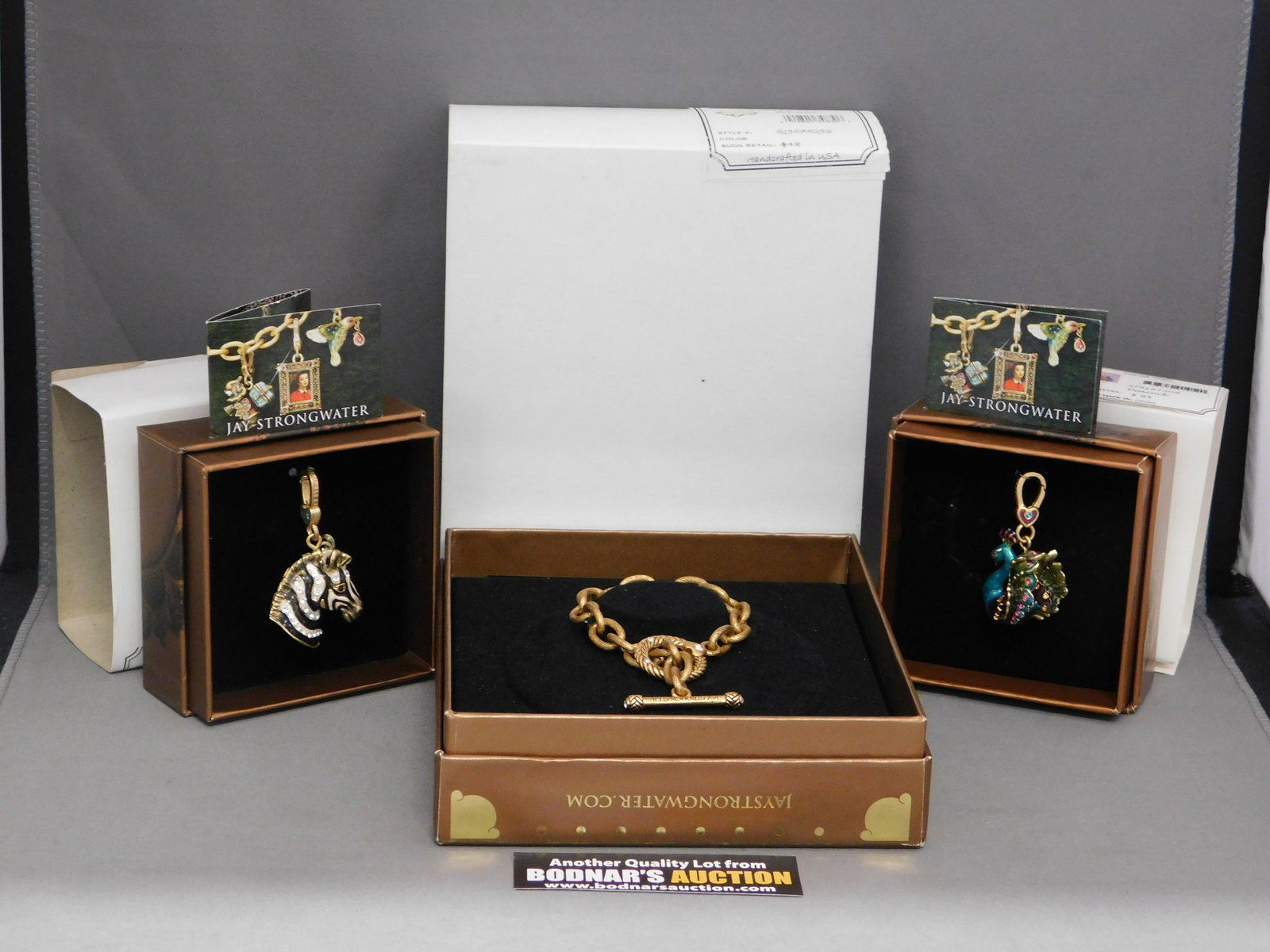 Jay Strongwater Rhodes Bracelet with Buddha Charm: Jay Strongwater 7 1/2" Rhodes Toggle Bracelet with Zebra and Peacock Charm. The charms Measures approx. 2" to the top of the clasp. They come in the original boxes. All invoices must be paid within 24