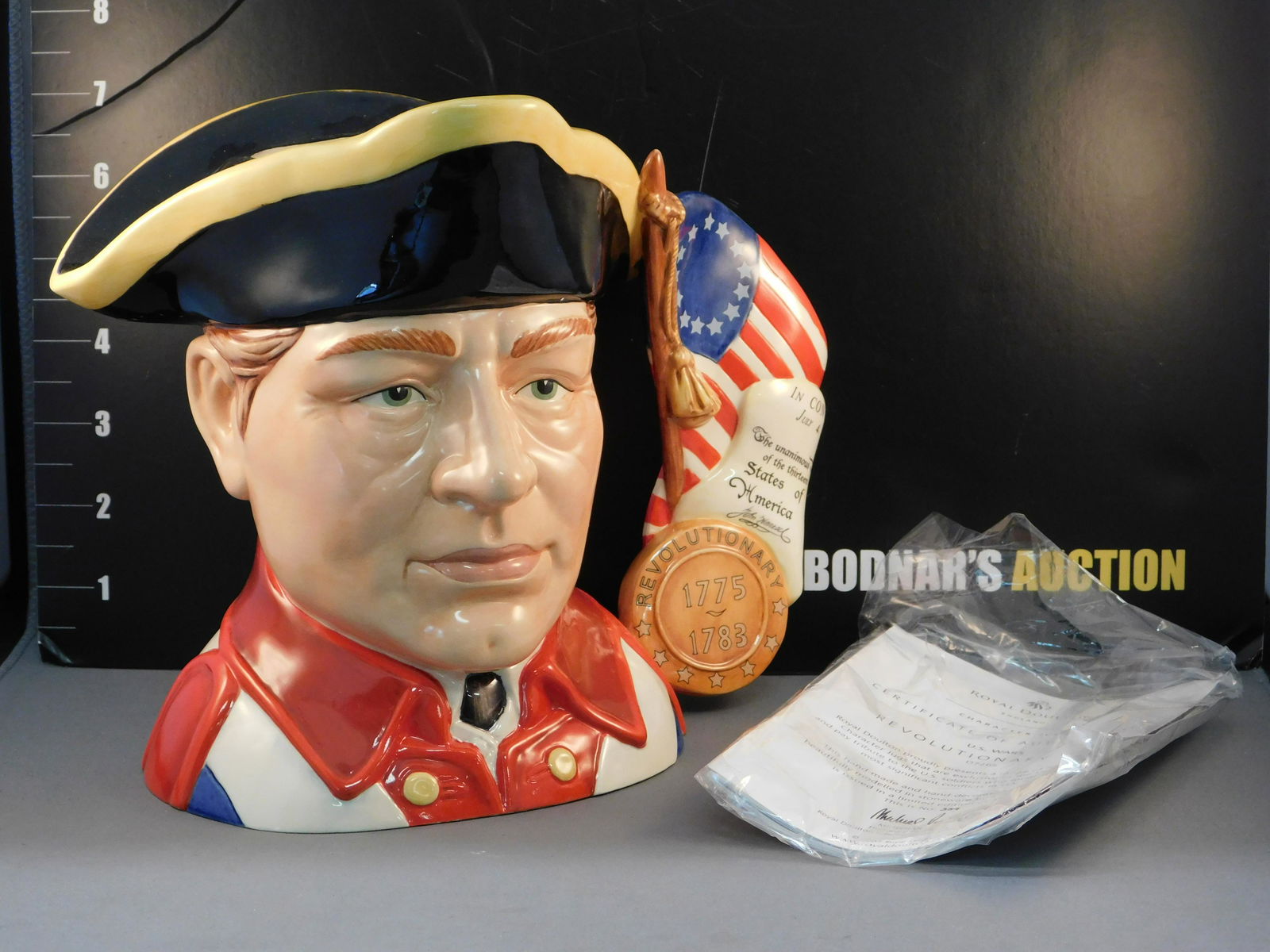 Royal Doulton US Wars - Revolutionary War Character Jug: Royal Doulton US Wars - Revolutionary War Character/Toby Jug. D7265. Dated 2007. Limited Edition 339/350. Measures 7.5" tall x 10" wide. All invoices must be paid within 24 hours of the sale. All item