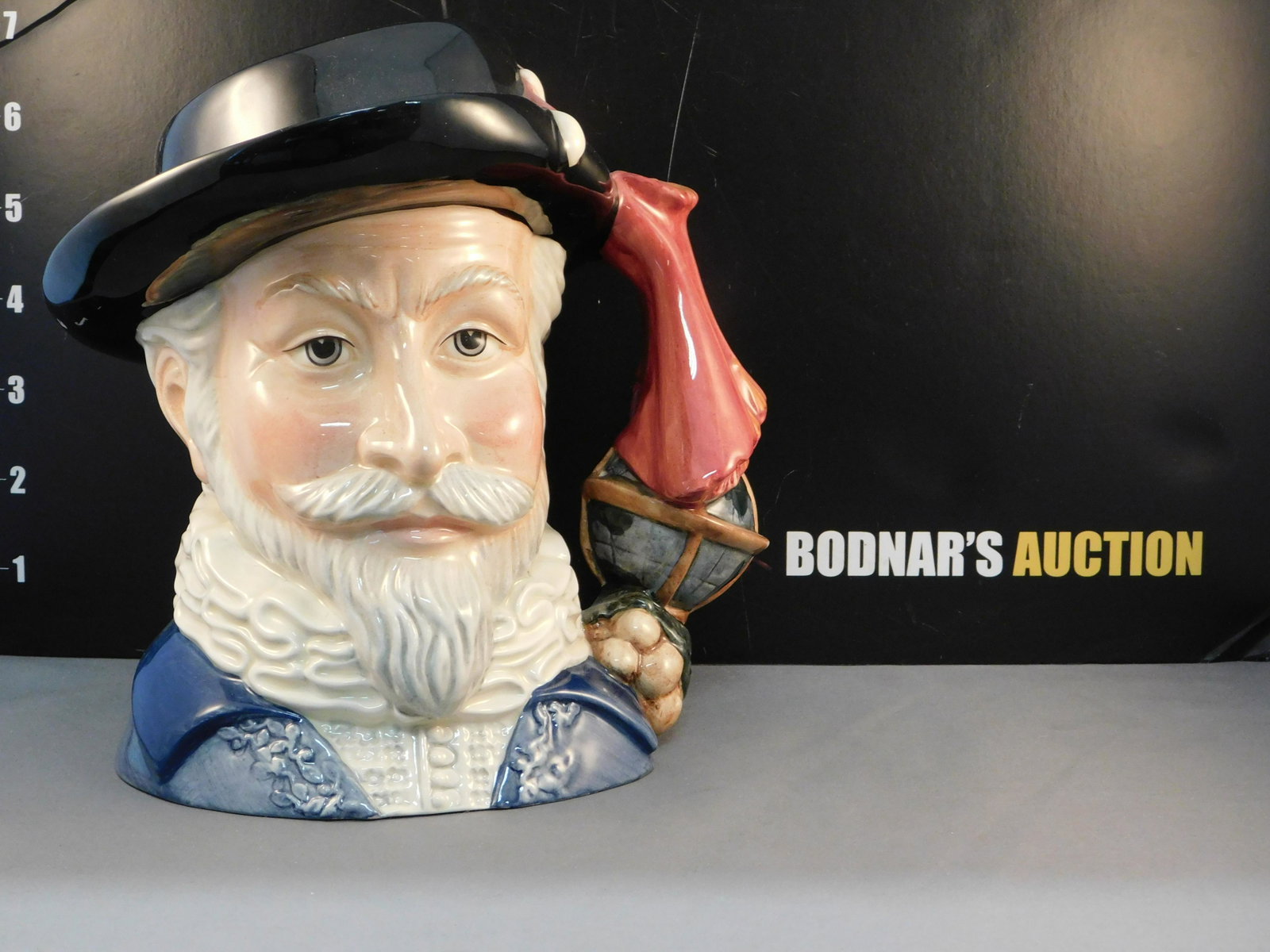 Royal Doulton Sir Walter Raleigh Character Jug: Royal Doulton Sir Walter Raleigh Character/Toby Jug. Character Jug of the Year 2002. D7169. Dated 2001. Measures 7.5" tall x 7" wide. All invoices must be paid within 24 hours of the sale. All items a