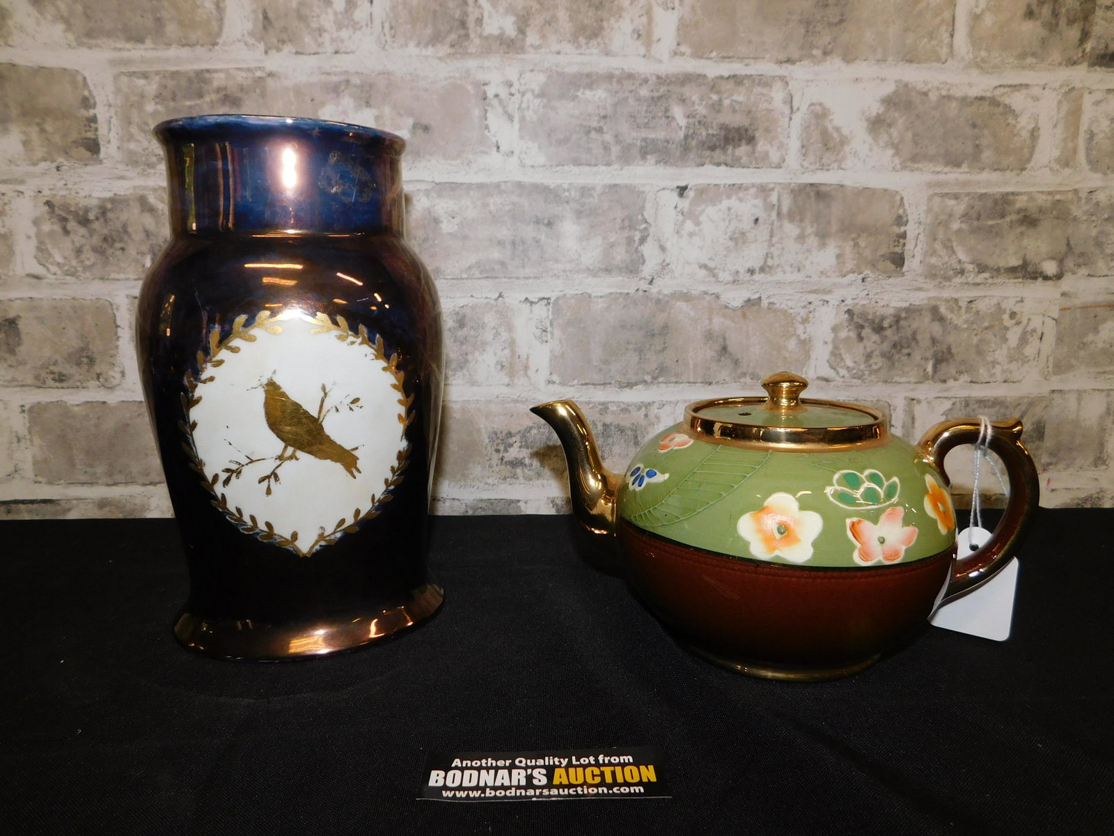 Group Lot of a Luster Tea Pot and Luster Pitcher: Group Lot of a Luster Tea Pot - Signed Gibsons - Made in England measuring 4" x 8" and a Luster and Painted Pitcher Marked Bavaria 8.5" x 5.5". You are bidding at a live sale. Please read the terms an