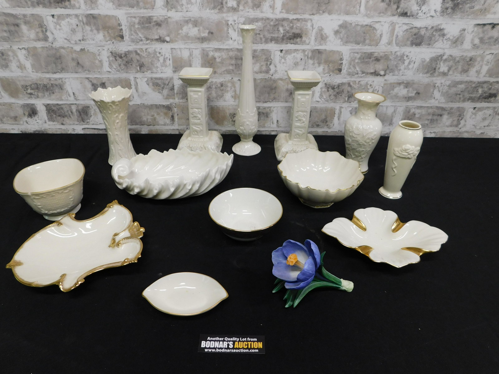 Box Lot of Lenox including Green Marked Lenox: Box Lot of Lenox including Green Marked Lenox. Flower has minor chips. You are bidding at a live sale. Please read the terms and conditions. This sale will be broadcast live on sale day with full desc