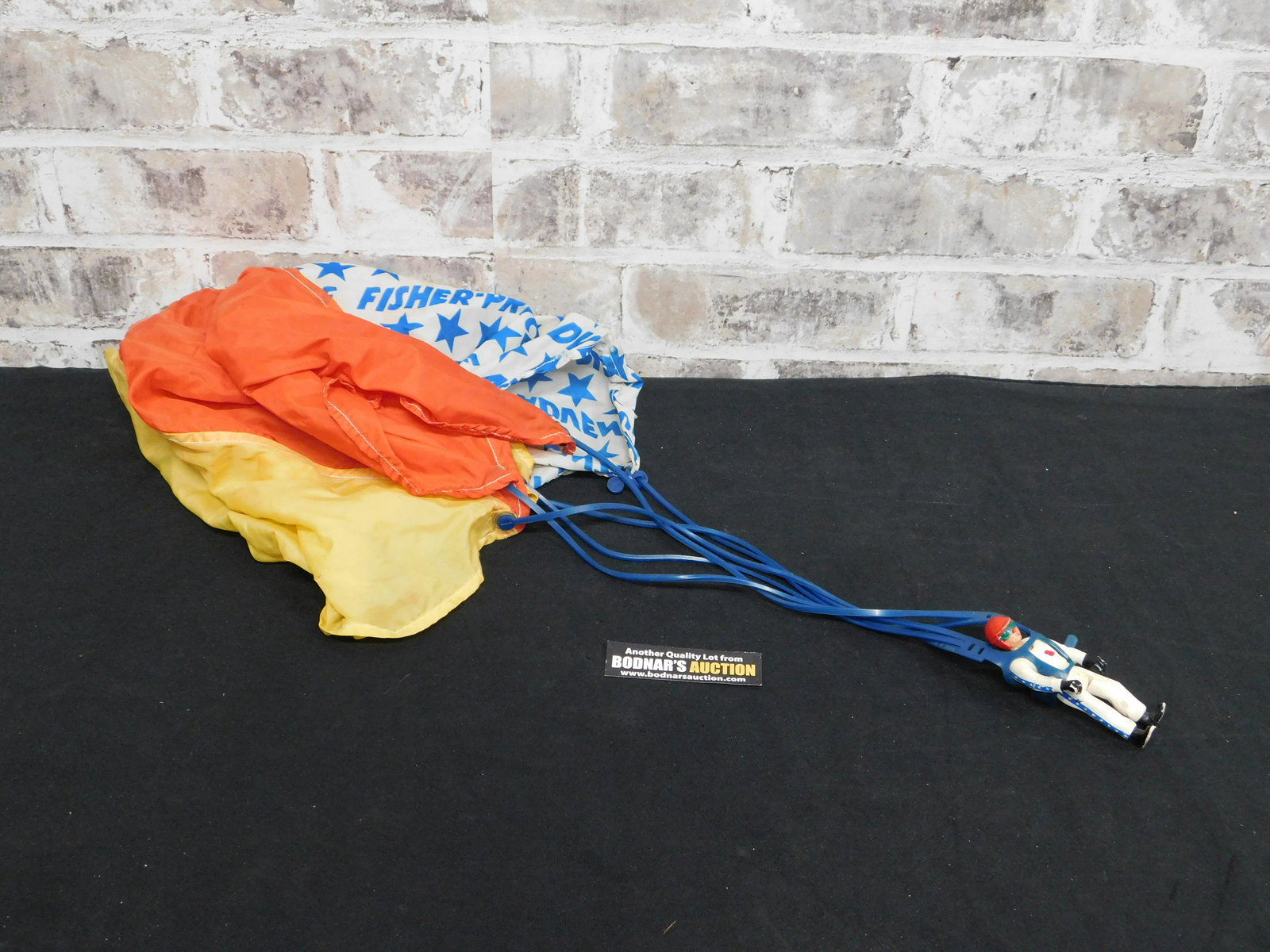 Vintage Fisher Price Parachuting Man with Parachute: Vintage Fisher Price Parachuting Man with Parachute. Custom Nose Bleed! Please read the terms and conditions. This sale will be broadcast live on sale day with full descriptions of each lot being sold