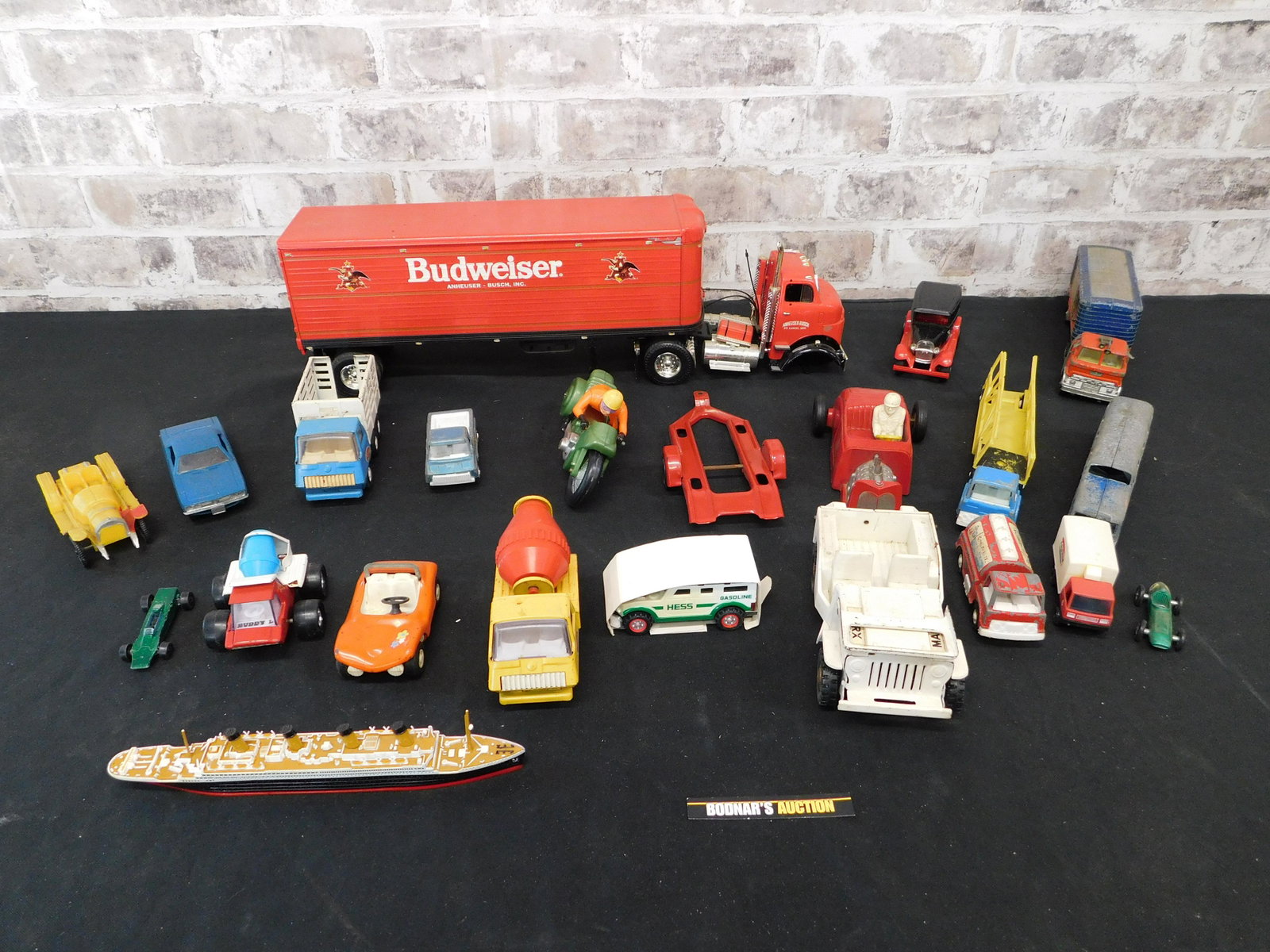 Lot of Vintage Cars: Lot of Vintage Cars - Pressed Steel and Diecast. Including Budweiser Tractor Trailer. Please read the terms and conditions. This sale will be broadcast live on sale day with full descriptions of each 