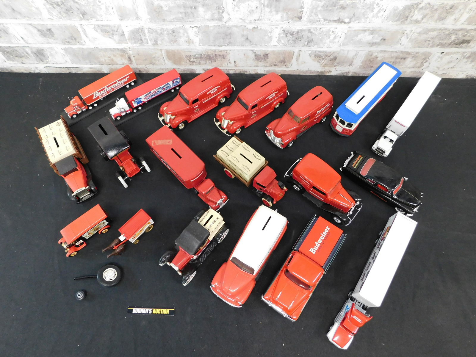 Large Lot of Diecast Banks and Trucks: Large Lot of Diecast Banks and Trucks - Mostly Budweiser. Please read the terms and conditions. This sale will be broadcast live on sale day with full descriptions of each lot being sold, as well as v