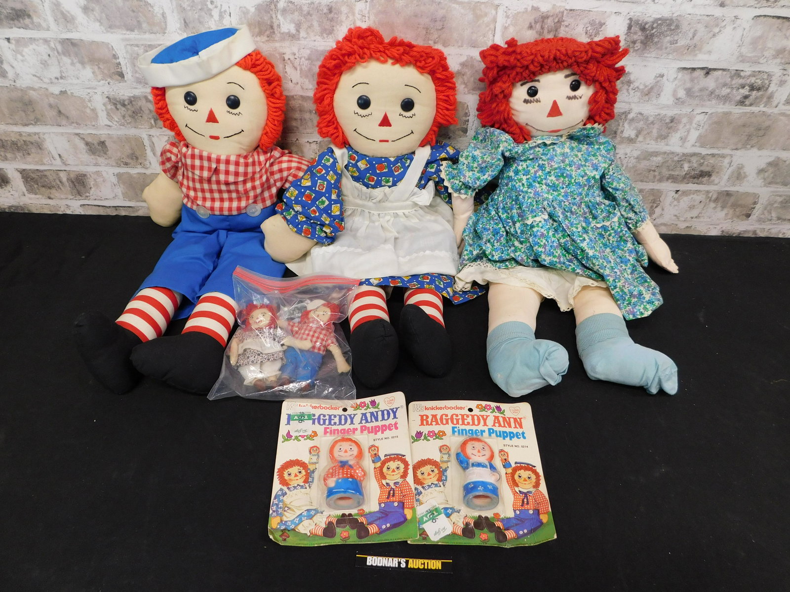 Box Lot of Raggedy Ann and Andy Dolls: Box Lot of Raggedy Ann and Andy Dolls. Please read the terms and conditions. This sale will be broadcast live on sale day with full descriptions of each lot being sold, as well as video feed of each l