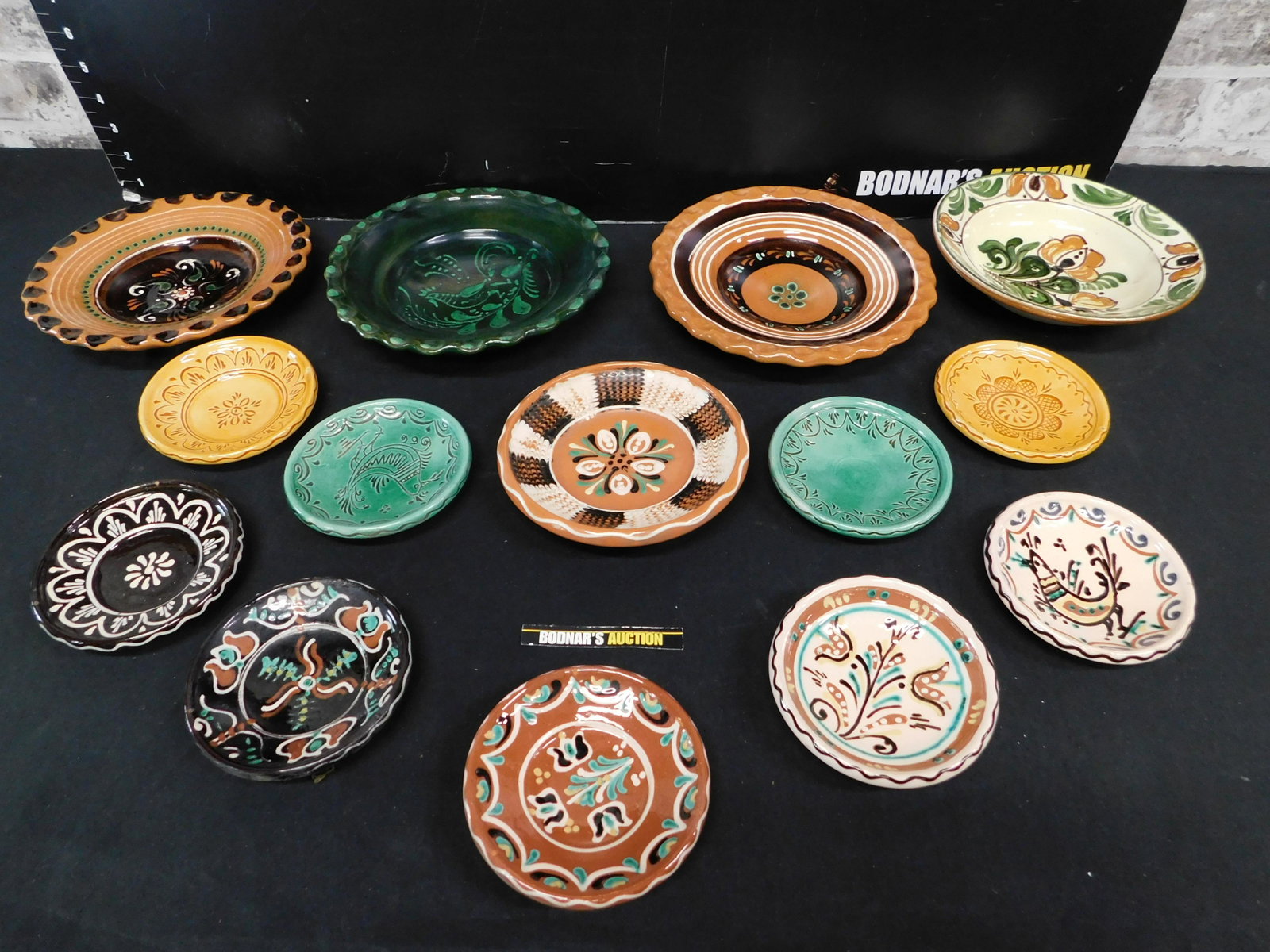 Lot of 14 Hungarian Hand Painted Art Pottery Plates and: Lot of 14 Hungarian Hand Painted Art Pottery Plates and Bowls. Most Signed Steig. Please read the terms and conditions. This sale will be broadcast live on sale day with full descriptions of each lot 
