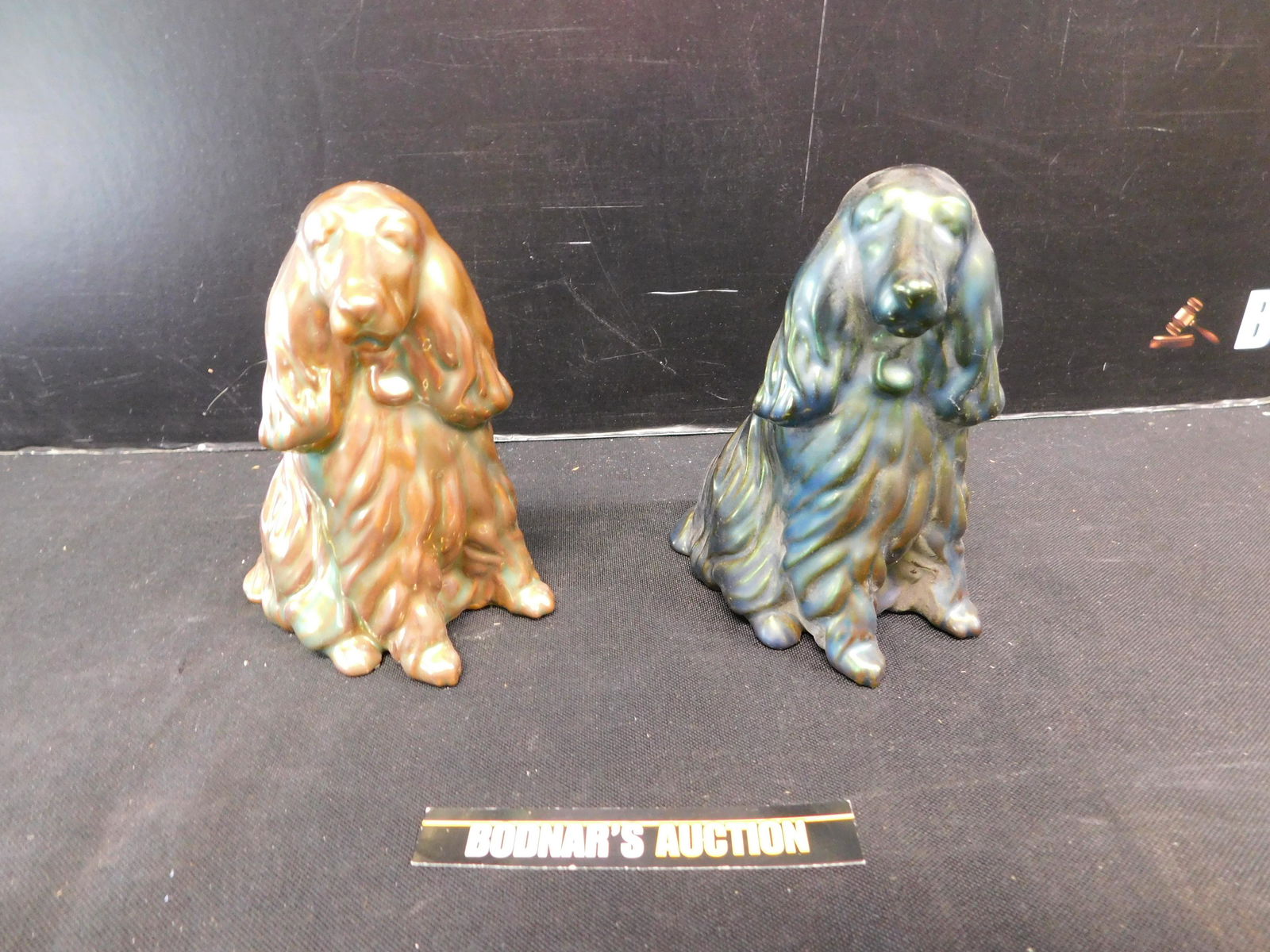 Pair of Hungarian Zsolnay Dog Figurines: Pair of Hungarian Zsolnay Dog Figurines. Measures 5" tall x 3.5" wide. Please read the terms and conditions. This sale will be broadcast live on sale day with full descriptions of each lot being sold,