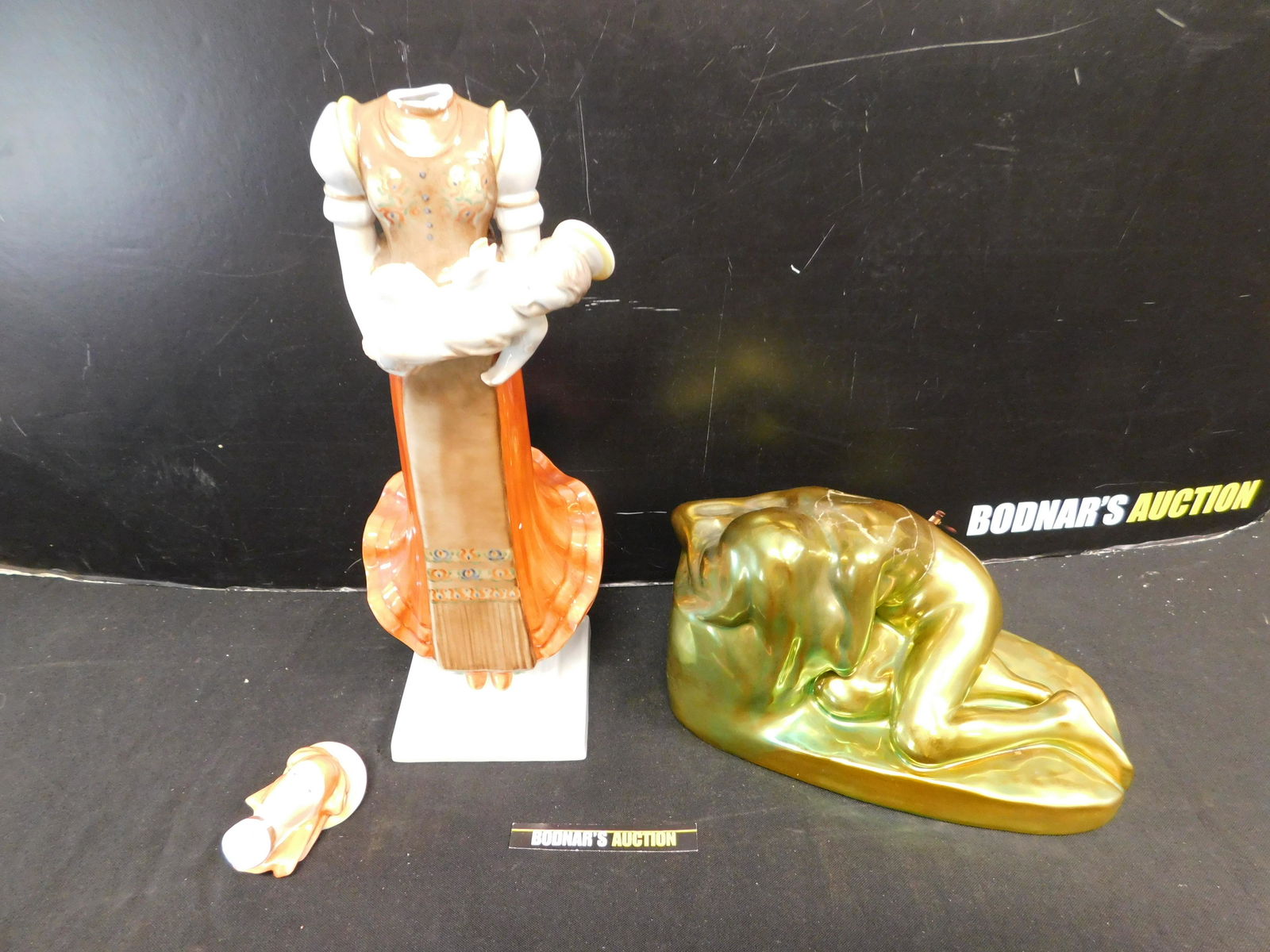 Lot of 2 AS-IS Hungarian Statues: Lot of 2 AS-IS Hungarian Statues including Herend Madonna with Child - Head needs to be repaired and Zsolnay Art Pottery Nude Figure - Has been totally repaired. Please read the terms and conditions.