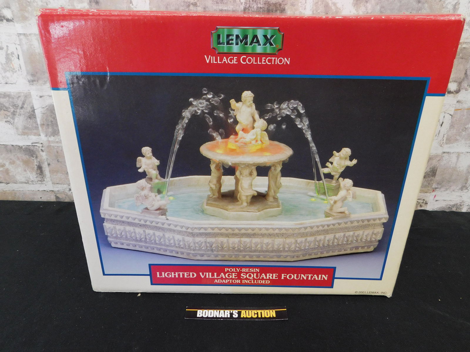 Lemax Vintage Collection Lighted Village Square: Lemax Vintage Collection Lighted Village Square Fountain. Like New in Box. Please read the terms and conditions. This sale will be broadcast live on sale day with full descriptions of each lot being s