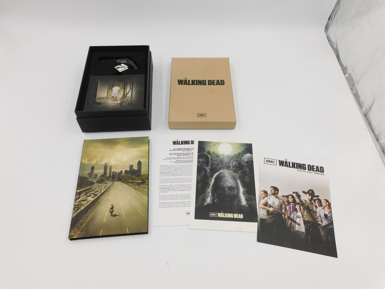The Walking Dead Season 1 Press Kit DVD Box Set: The Walking Dead Season 1 Press Kit DVD Box Set with Book and Rick Grimes Gun Collectible. All invoices must be paid within 24 hours of the sale. All items are shipped USPS or UPS and will be billed s