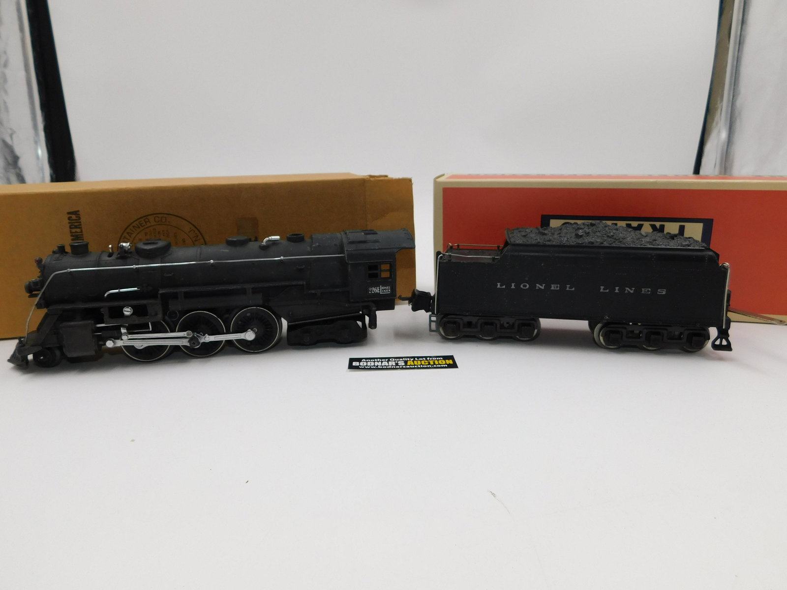 Lionel 027 226E Steam Engine with 2226W Whistling: Lionel 027 226E Steam Engine with 2226W Whistling Tender - Both are Repro Boxes. All invoices must be paid within 24 hours of the sale. All items are shipped USPS or UPS and will be billed separately.