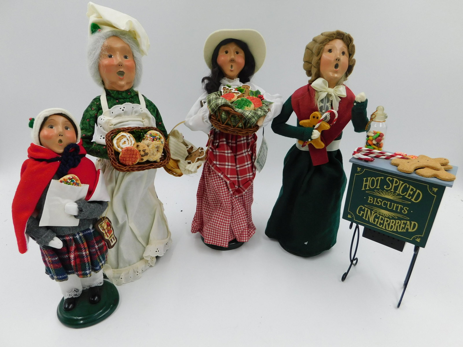 Lot of Byers Choice Carolers and Accessories: Byers Choice Caroler and Accessory Lot including 4 Cookie Related Carolers and Hot Spiced Gingerbread Stand Accessory. All carolers are signed on the base and 1 is numbered. Please read the terms and 