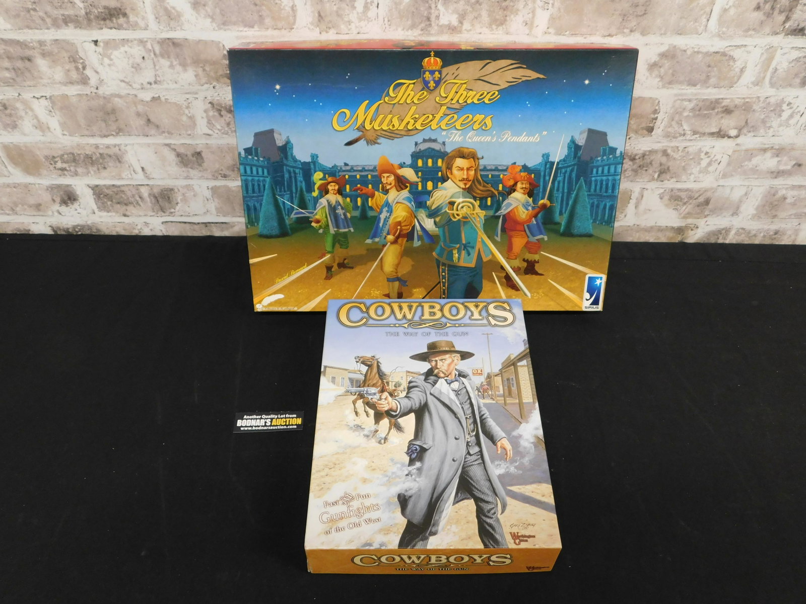 Lot of 2 Board/Strategy Games: Lot of 2 Board/Strategy Games including The Three Musketeers by Sirius and Cowboys - The Way of the Gun by Worthington Games. Both appear to be in very good/used condition. Please refer to the photos 
