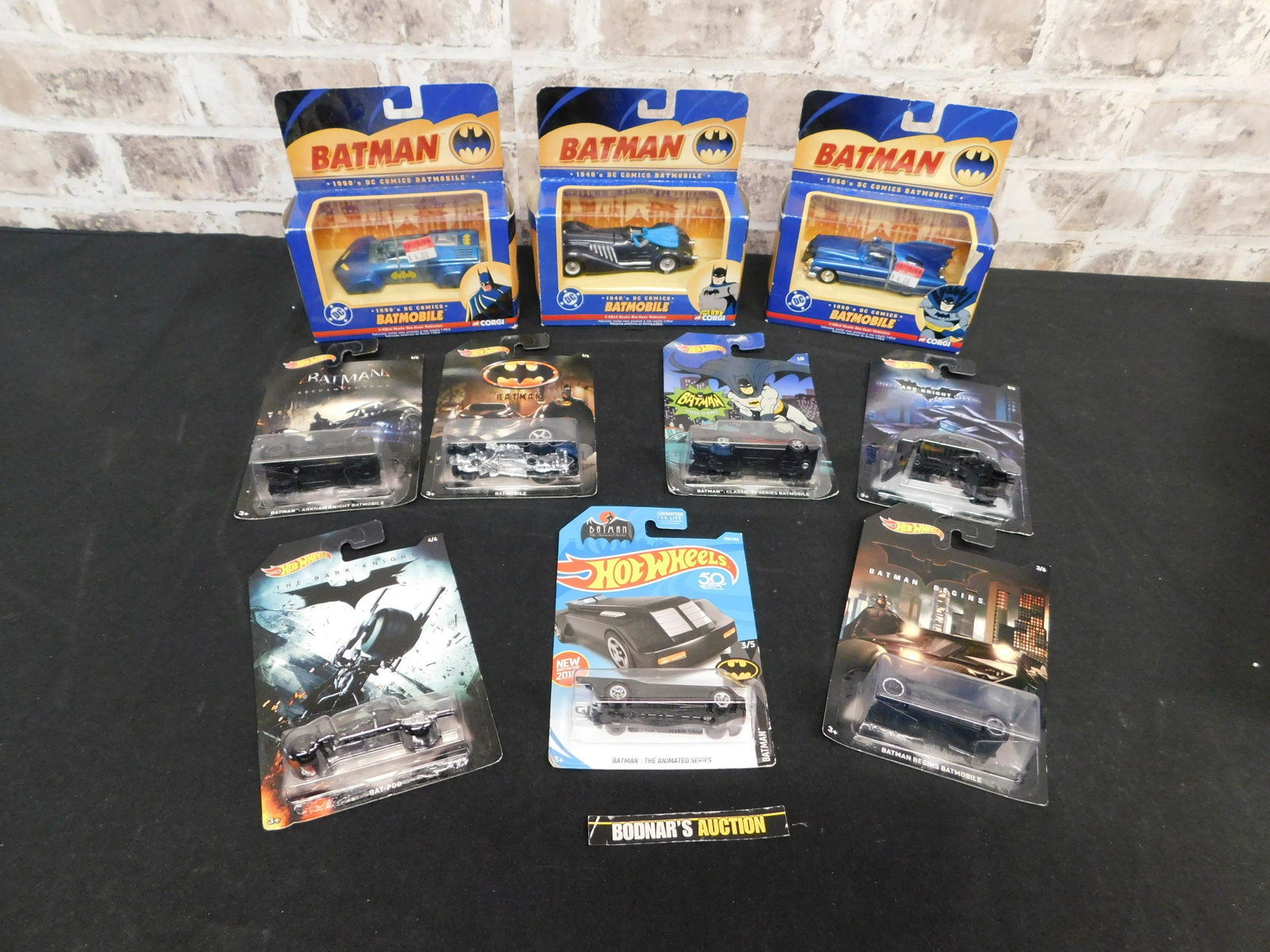 Lot of Batman Vehicles: Lot of Batman Vehicles including 1:64 Scale Hotwheels and 1:43 Scale Corgis. Please read the terms and conditions. This sale will be broadcast live on sale day with full descriptions of each lot being