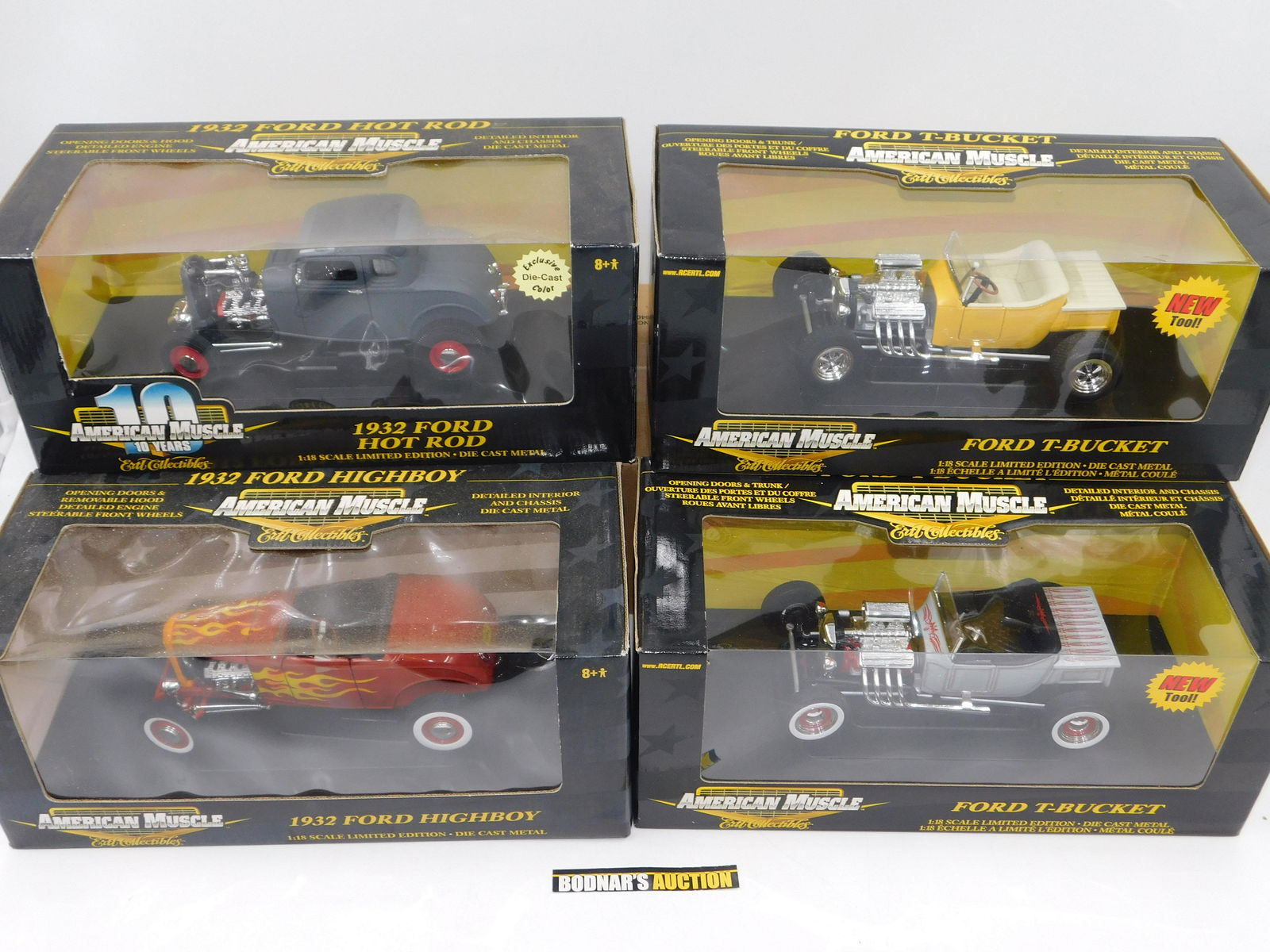 Lot of 4 American Muscle Ford Diecast Cars: Lot of 4 American Muscle Ford Diecast Cars including (2) Ford T-Bucket (Yellow and Gray), 1932 Hot Rod, and 1932 Ford Highboy. All Limited Edition 1:18 Scale Diecast. Comes in Original Box. All invoic