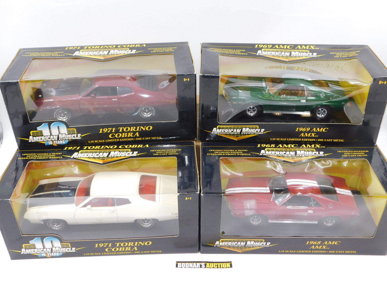 Lot of 4 American Muscle Diecast Cars - Torino Cobra: Lot of 4 American Muscle Diecast Cars including (2) 1971 Torino Cobra (Maroon and White), 1968 AMC AMX, and 1969 AMC AMX. All Limited Edition 1:18 Scale Diecast. Comes in Original Box. All invoices mu