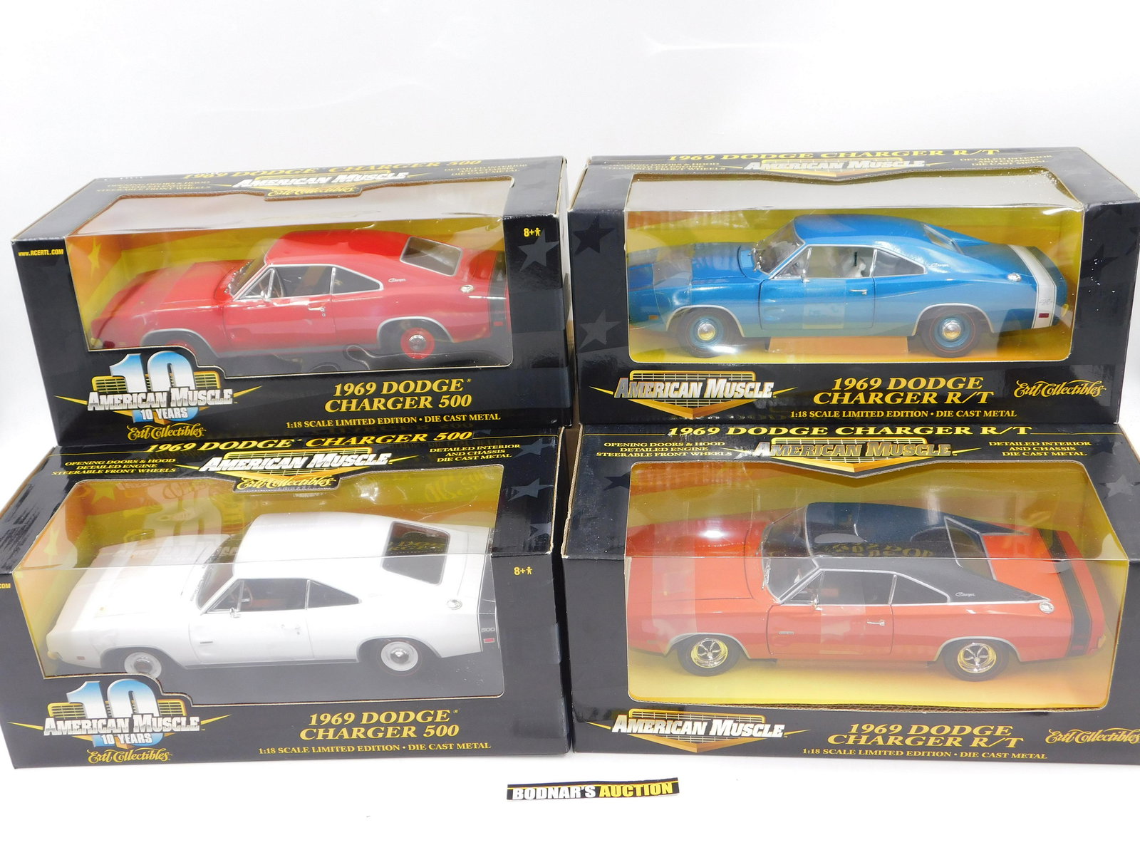 Lot of 4 American Muscle Dodge Charger Diecast Cars: Lot of 4 American Muscle Dodge Charger Diecast Cars including (2) 1969 Dodge Charger 500 (Red and White) and (2) 1969 Dodge Charger R/T (Blue and Orange). All Limited Edition 1:18 Scale Diecast. Comes