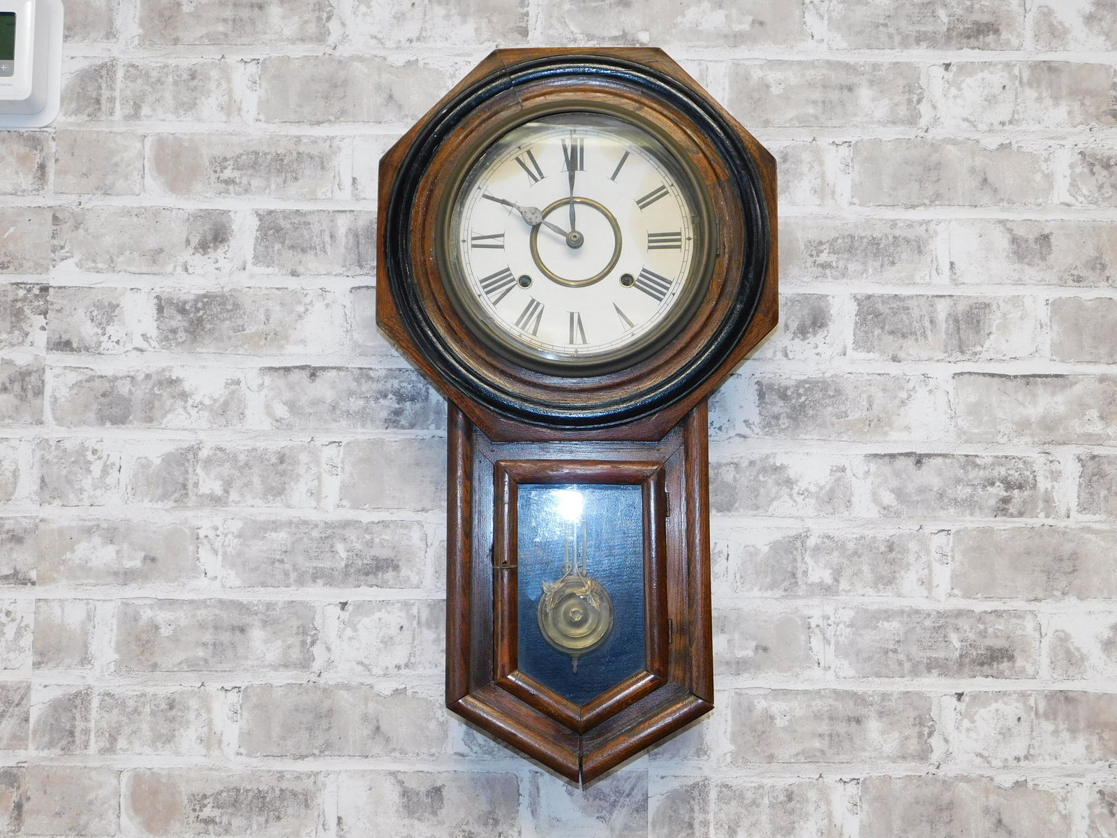 Wall Regulator Clock: Wall regulator clock, slightly coming apart at the bottom seam. Measures approx. 23 inches tall by 13 inches wide. Please read the terms and conditions. This sale will be broadcast live on sale day wi