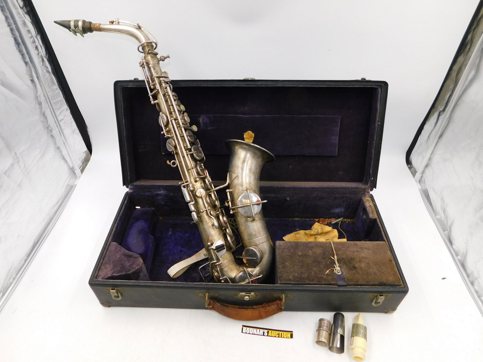 Abbott Premiere Silver-Toned Saxophone: Abbott Premiere Silver-Toned Saxophone. Marked Low Pitch Serial 174170. Does have wear but overall good condition. Comes with case. Measures approx. 24" long. Please read the terms and conditions. Thi