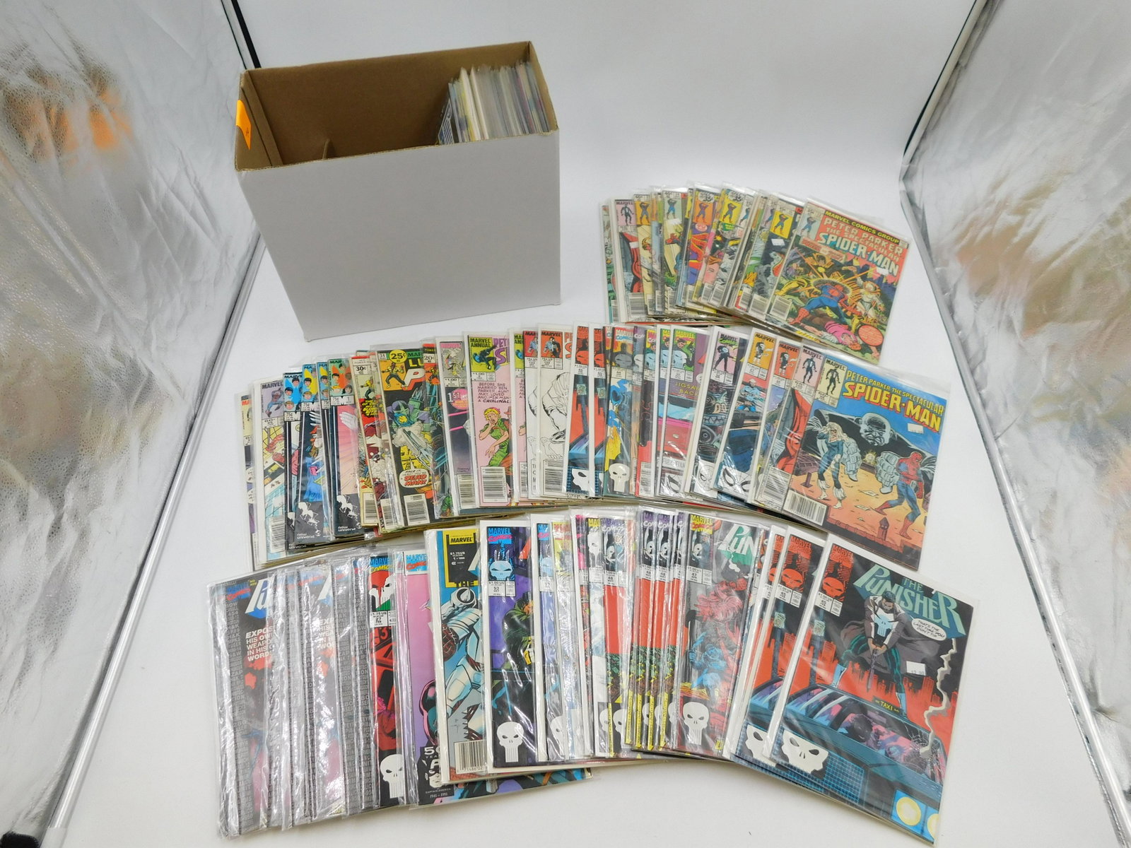 Short Box of Comics: Short Box of Comics including Peter Parker Spectacular Spider-Man, The Punisher, Punisher War Journal, Powerman and More. Please read the terms and conditions. This sale will be broadcast live on sale