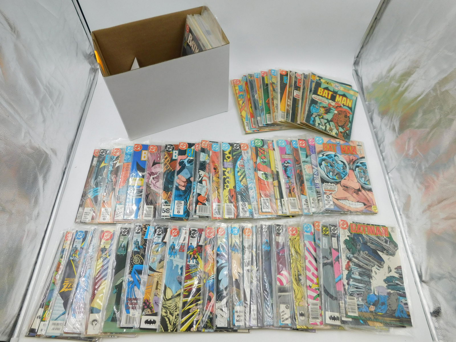 Short Box of Comics: Short Box of Comics including Batman from 70's-90's. Please read the terms and conditions. This sale will be broadcast live on sale day with full descriptions of each lot being sold. All items MUST be