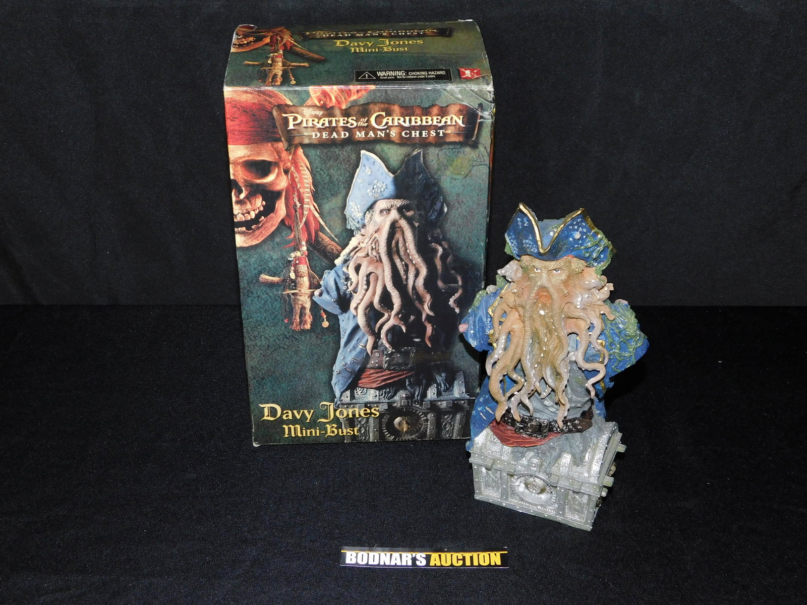 Pirates of the Caribbean Dead Mans Chest Davy Jones: Pirates of the Caribbean Dead Mans Chest Davy Jones Mini Bust by NECA 446/1500. Comes with Original Box. Has some chips and is missing one handle. Measures 8.75" tall x 3.75" wide. Please read the ter
