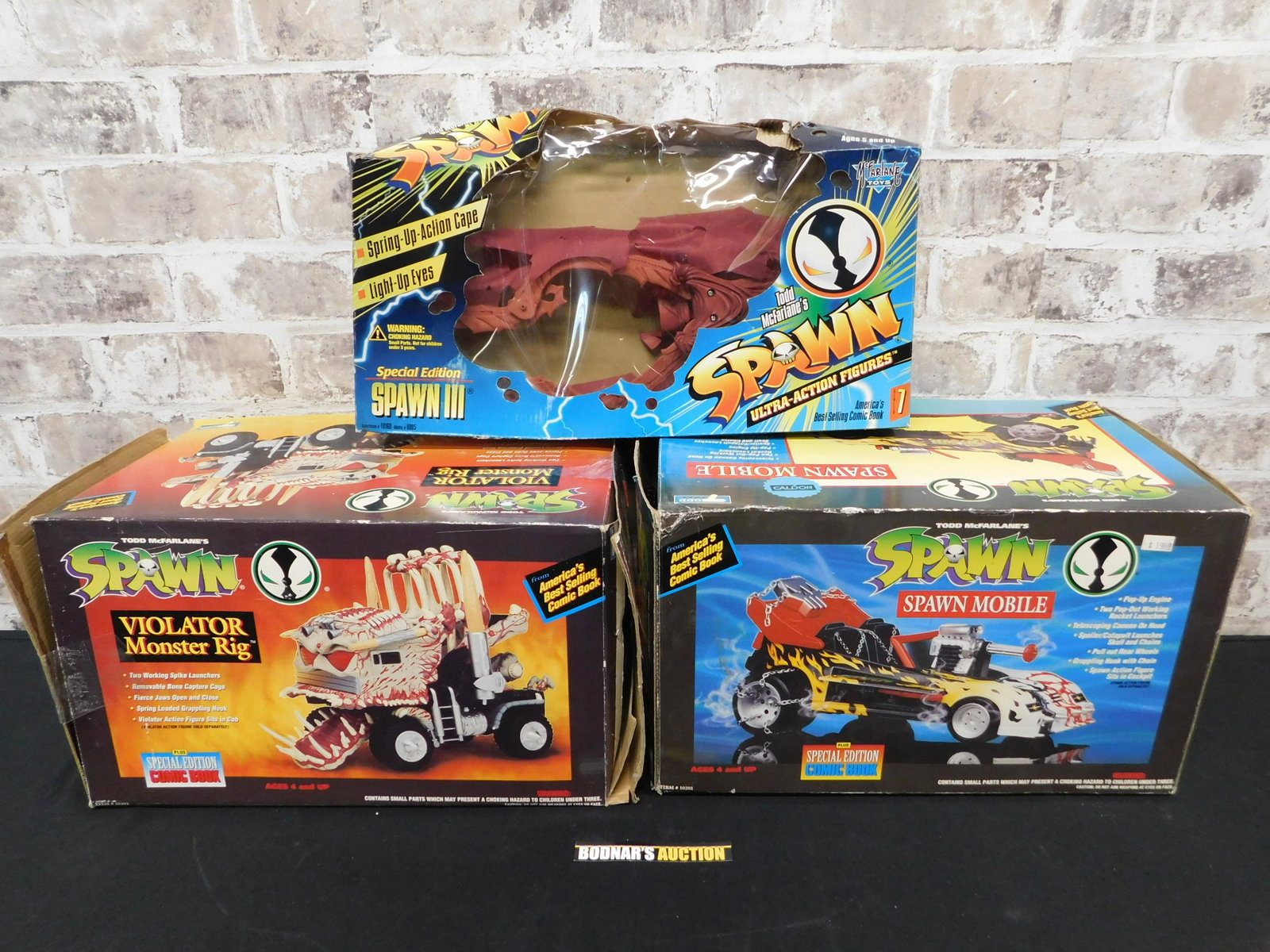 Lot of Spawn Toys: Lot of Spawn Toys including Violator, Spawn III, and Spawn Mobile. Opened Boxes. All items are shipped USPS or UPS and will be billed separately. A $10 handling fee is added to the shipping price per 