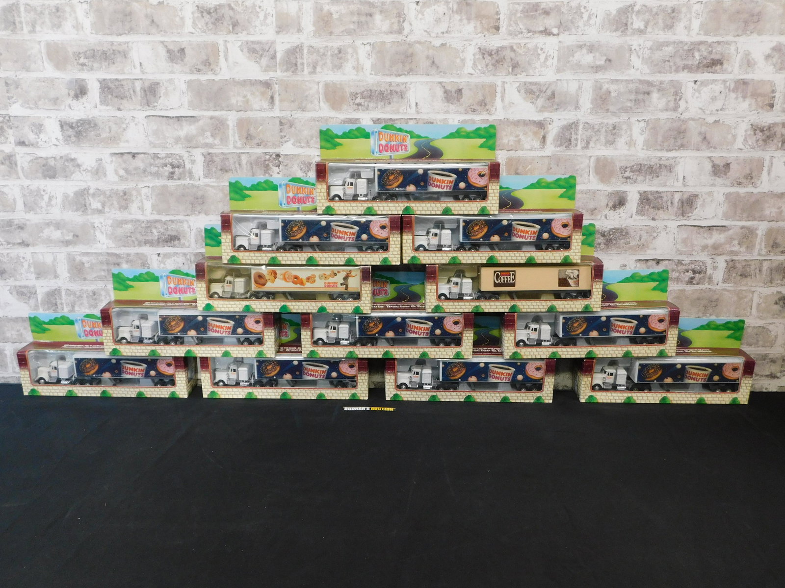 Lot of 12 Dunkin Donuts Tractor Trailers: Lot of 12 Dunkin Donuts Tractor Trailers. All items are shipped USPS or UPS and will be billed separately. A $10 handling fee is added to the shipping price per lot. Local pickups are in our South Bru