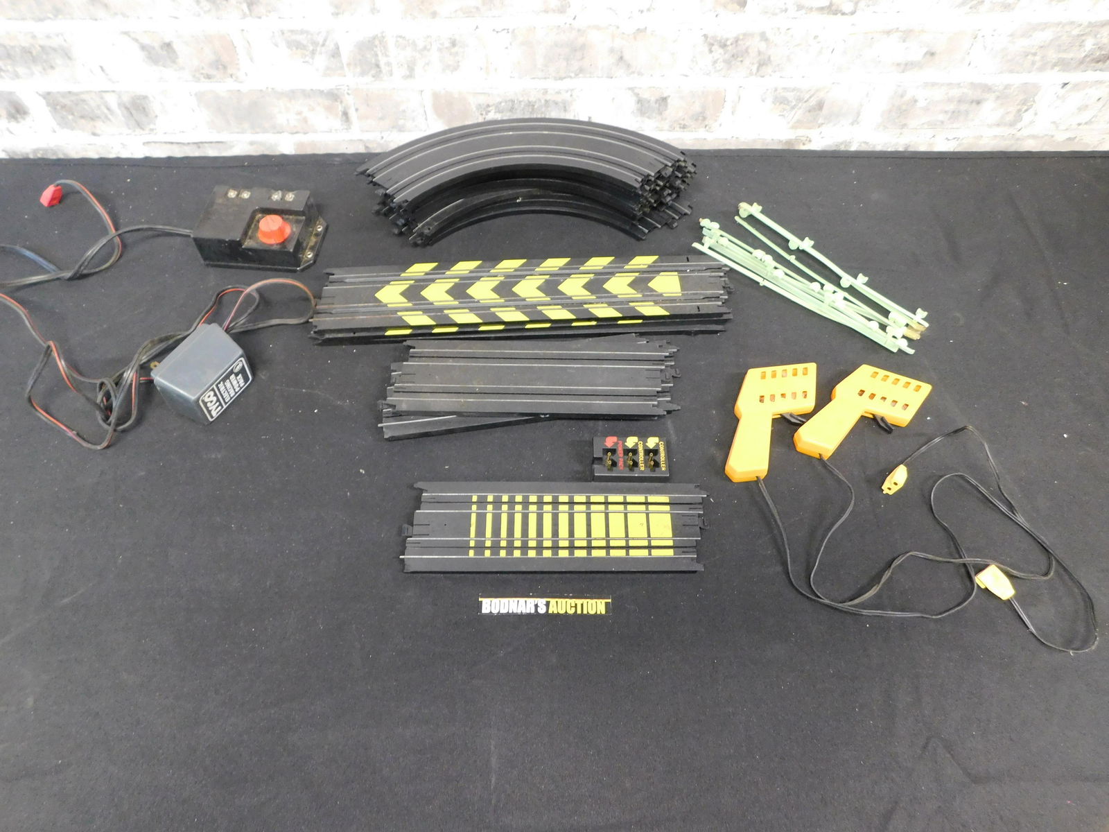 Lot of Tyco Slot Car Racing Track with Power Pack and: Lot of Tyco Slot Car Racing Track with Power Pack and Controllers. All items are shipped USPS or UPS and will be billed separately. A $10 handling fee is added to the shipping price per lot. Local pic