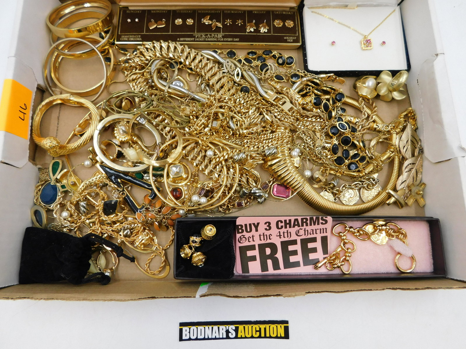 Large Lot of Gold-Tone Costume Jewelry: Large Lot of Gold-Tone Costume Jewelry. Including Many Signed Pieces - Joan Rivers, Juicy and More, Gold Plated and Filled. This sale will be broadcast live on sale day with full descriptions of each 
