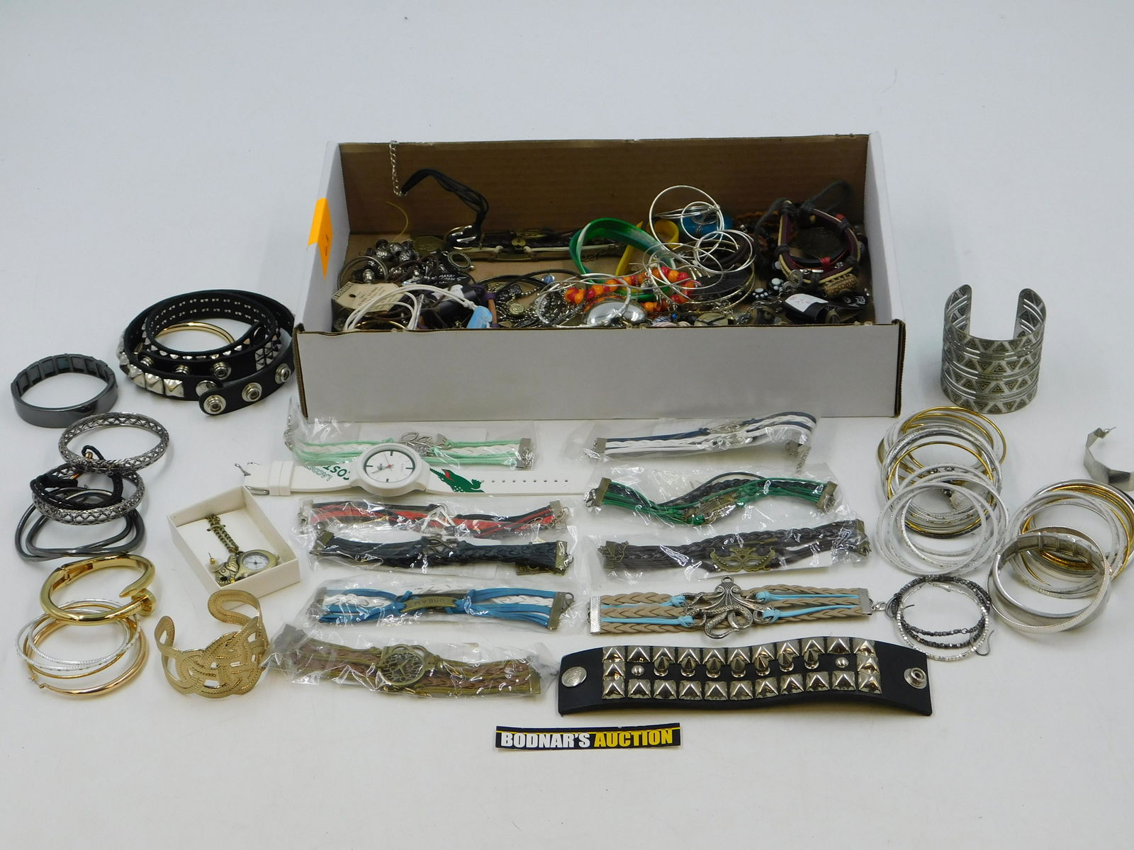 Lot of Costume Jewelry: Lot of Costume Jewelry including many bangles, Cuffs, Leather Bracelets and More. This sale will be broadcast live on sale day with full descriptions of each lot being sold. All items MUST be paid for