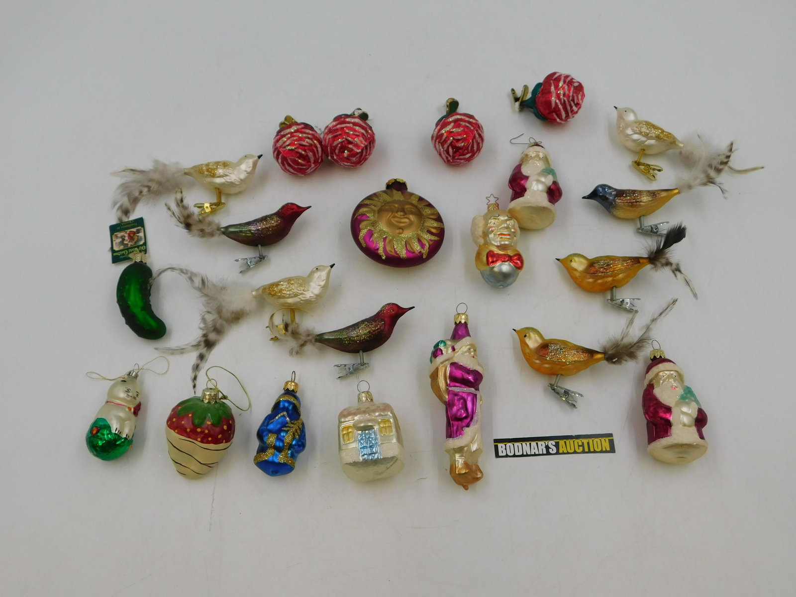 Lot of Glass Ornaments: Lot of Glass Ornaments including Birds, Santa's, Flowers, Strawberries and More. This sale will be broadcast live on sale day with full descriptions of each lot being sold. All items MUST be paid for 